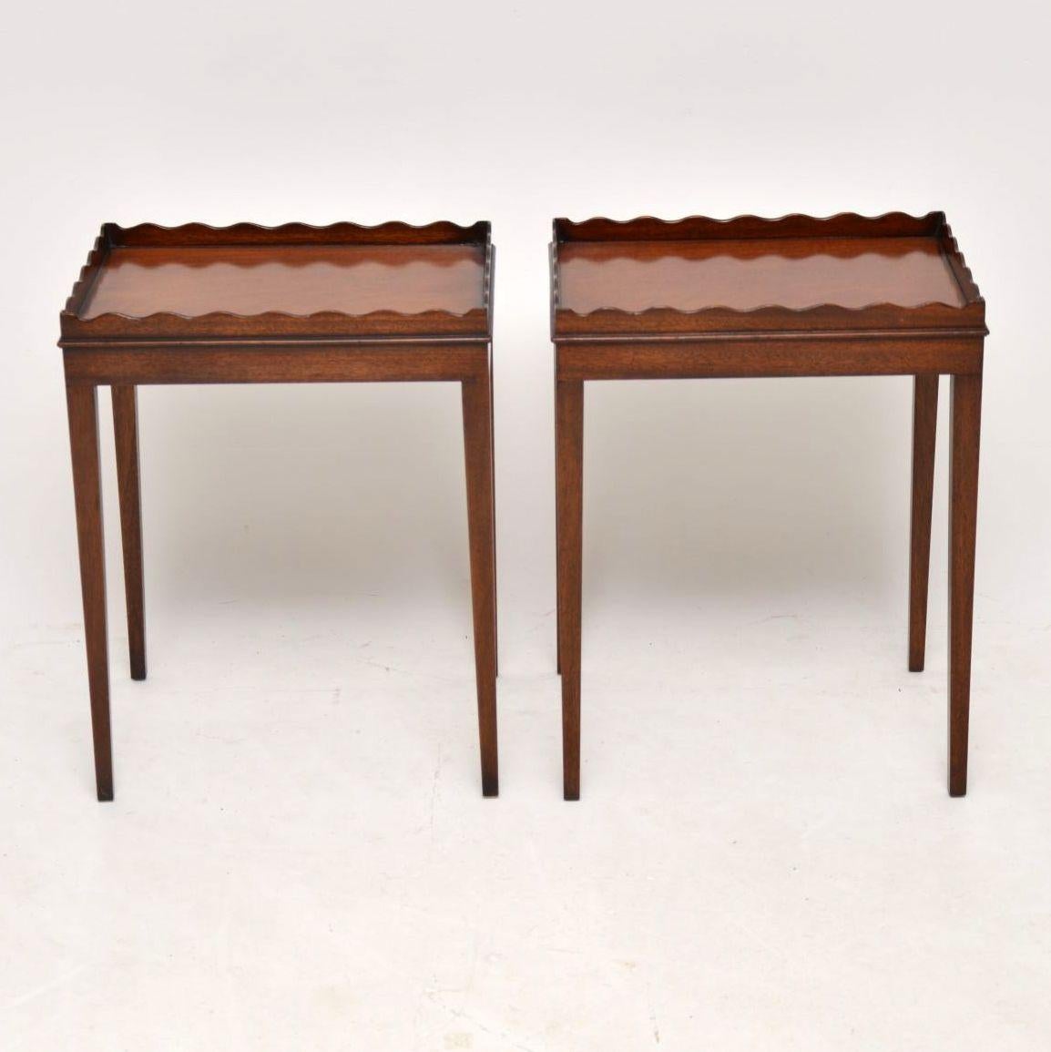 Pair of antique Georgian style mahogany side tables with pie crust tray tops and sitting on elegant tapered legs. They date to circa 1930s-1950s period and are in excellent condition. I think they would be very useful as lamp tables.

Measures: