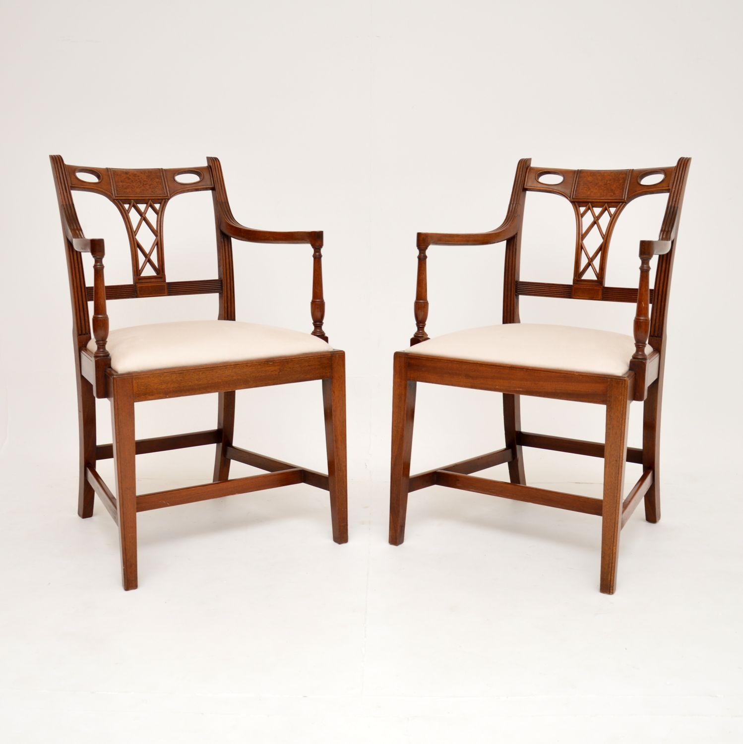 A beautiful and unusual pair of antique Georgian Style carver armchairs. They were made in England, and date from around 1920’s period.

The quality is outstanding, they are predominantly solid wood, with inset panels of burr walnut in the back