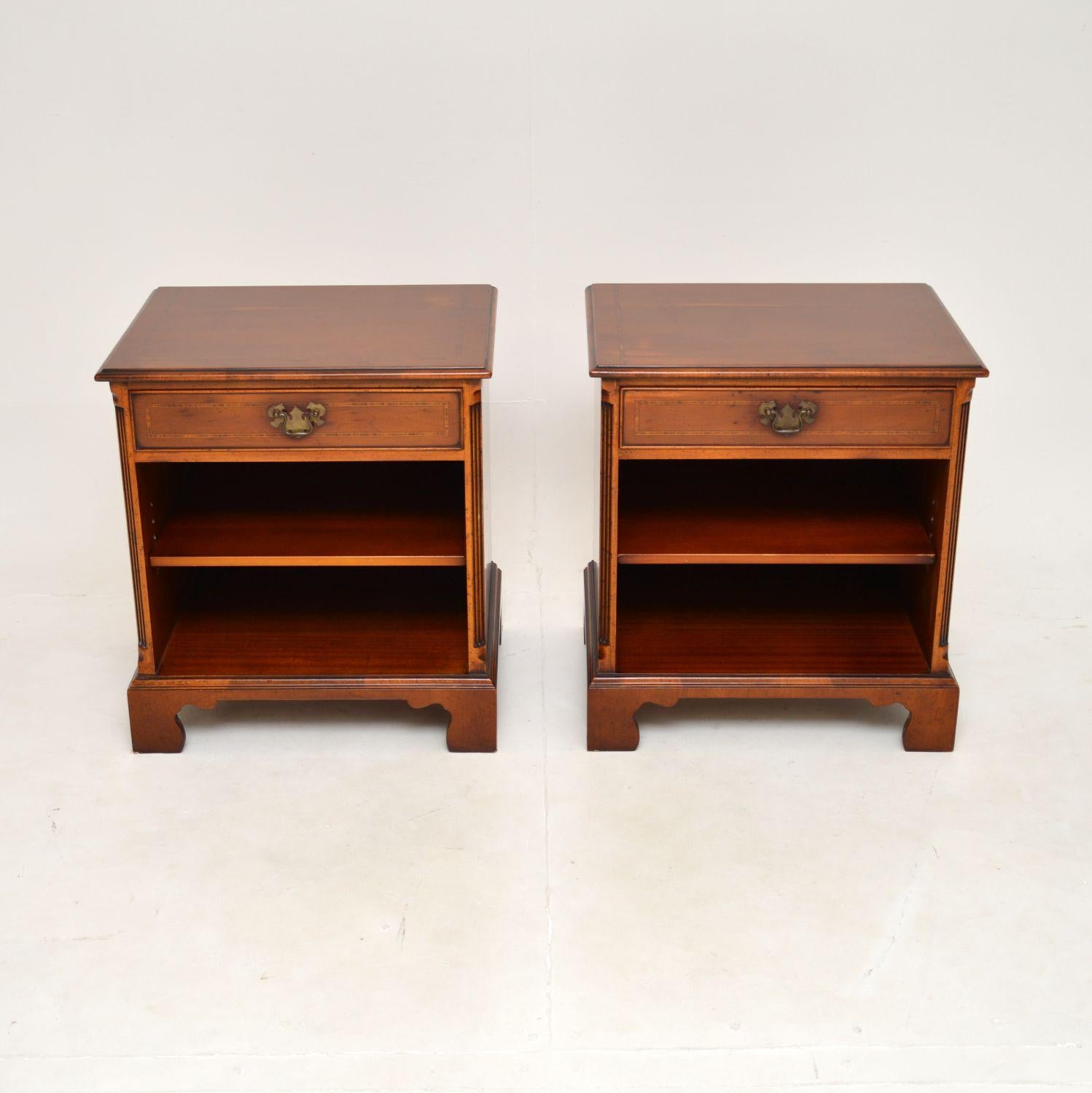 A lovely pair of antique Georgian style yew wood bedside cabinets. They were made in England, they date from around the 1960’s.

They are of superb quality and are a very useful size. Each has a single drawer at the top, with a lower open recessed