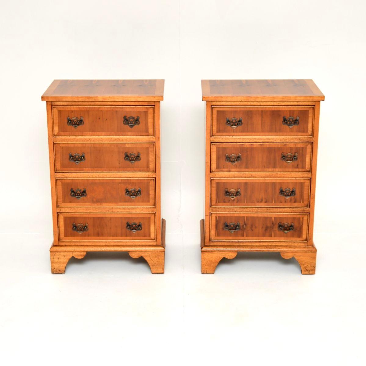 A lovely pair of antique Georgian style yew wood bedside chests. They were made in England, they date from around the 1950’s.

They are of superb quality and are a very useful size. Each has four drawers with lovely brass handles, they sit on