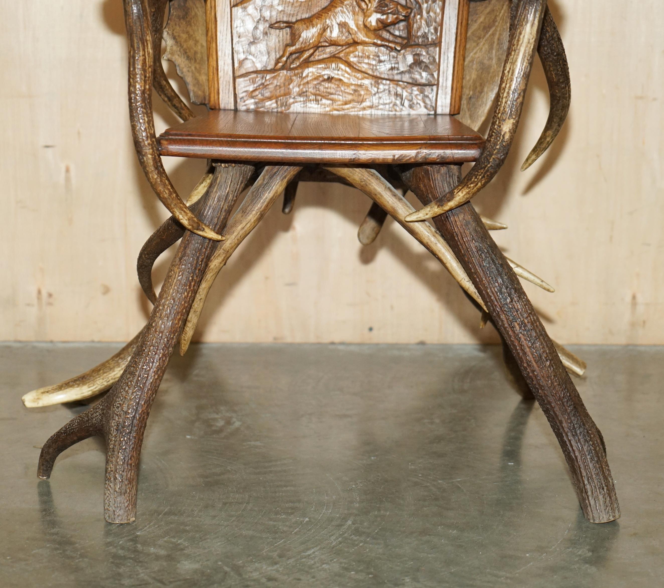 Oak PAIR OF ANTIQUE GERMAN BLACK FOREST CARVED ANTLER ARMCHAiRS PART OF A SUITE For Sale
