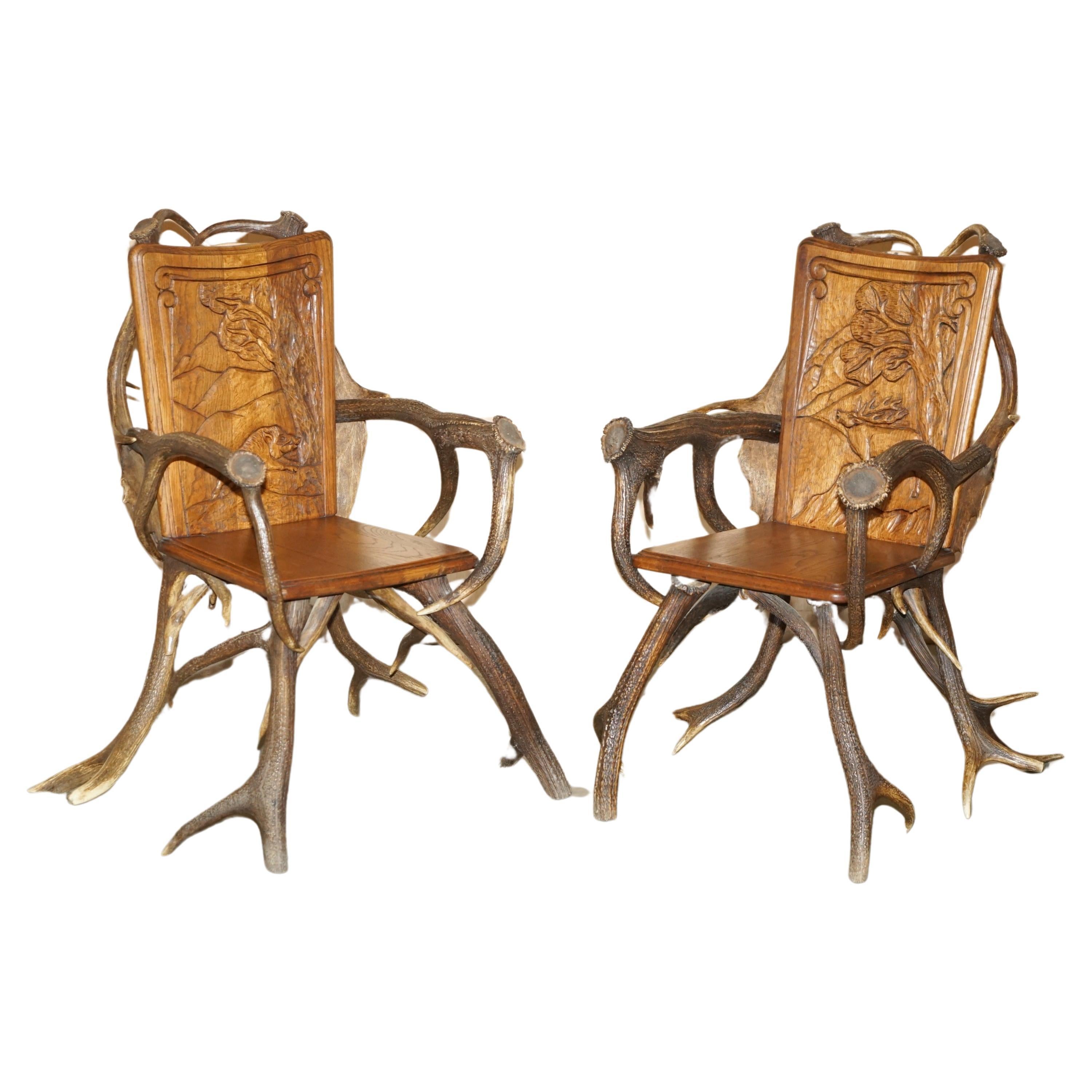 PAIR OF ANTIQUE GERMAN BLACK FOREST CARVED ANTLER ARMCHAiRS PART OF A SUITE For Sale
