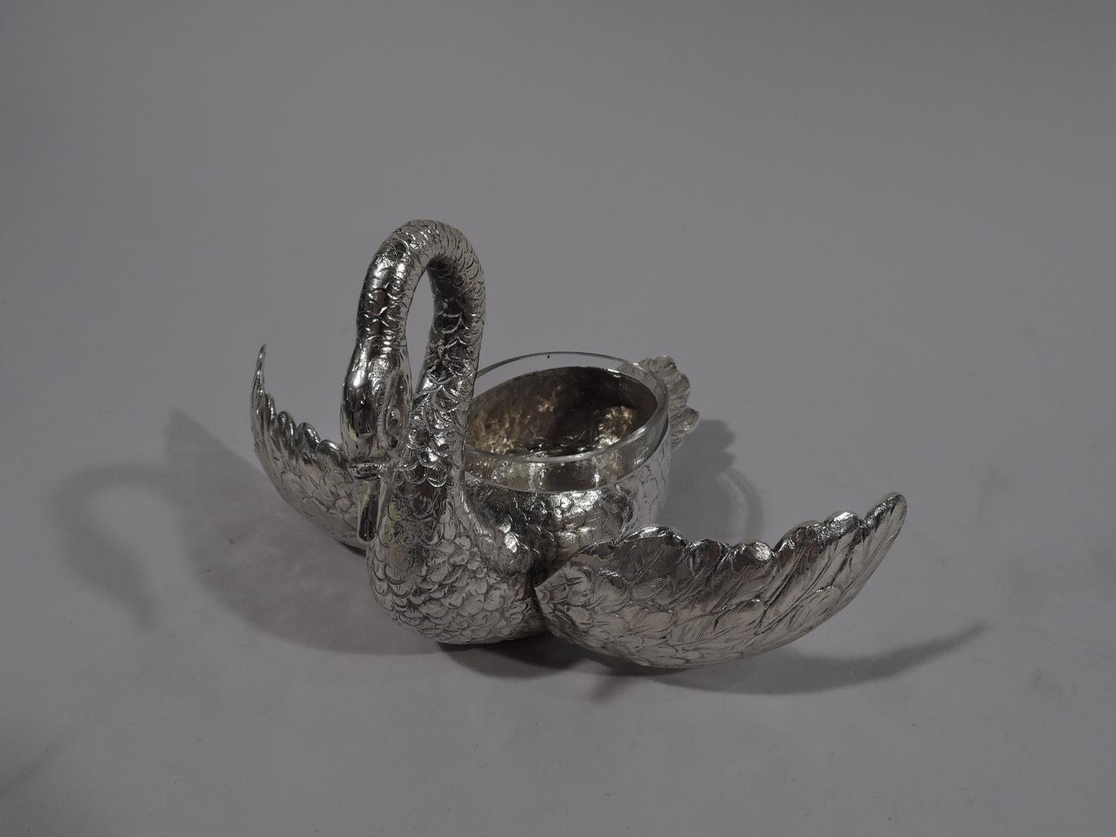 Pair of German 800 silver figural open salts, circa 1920. Each: A swan with hinged wings and erect tail. Nice plumage and scrolled neck terminating in triangular bill. With detachable clear glass liner. Marked.

Dimensions: H 3 1/2 x W 2 1/4 x D 4
