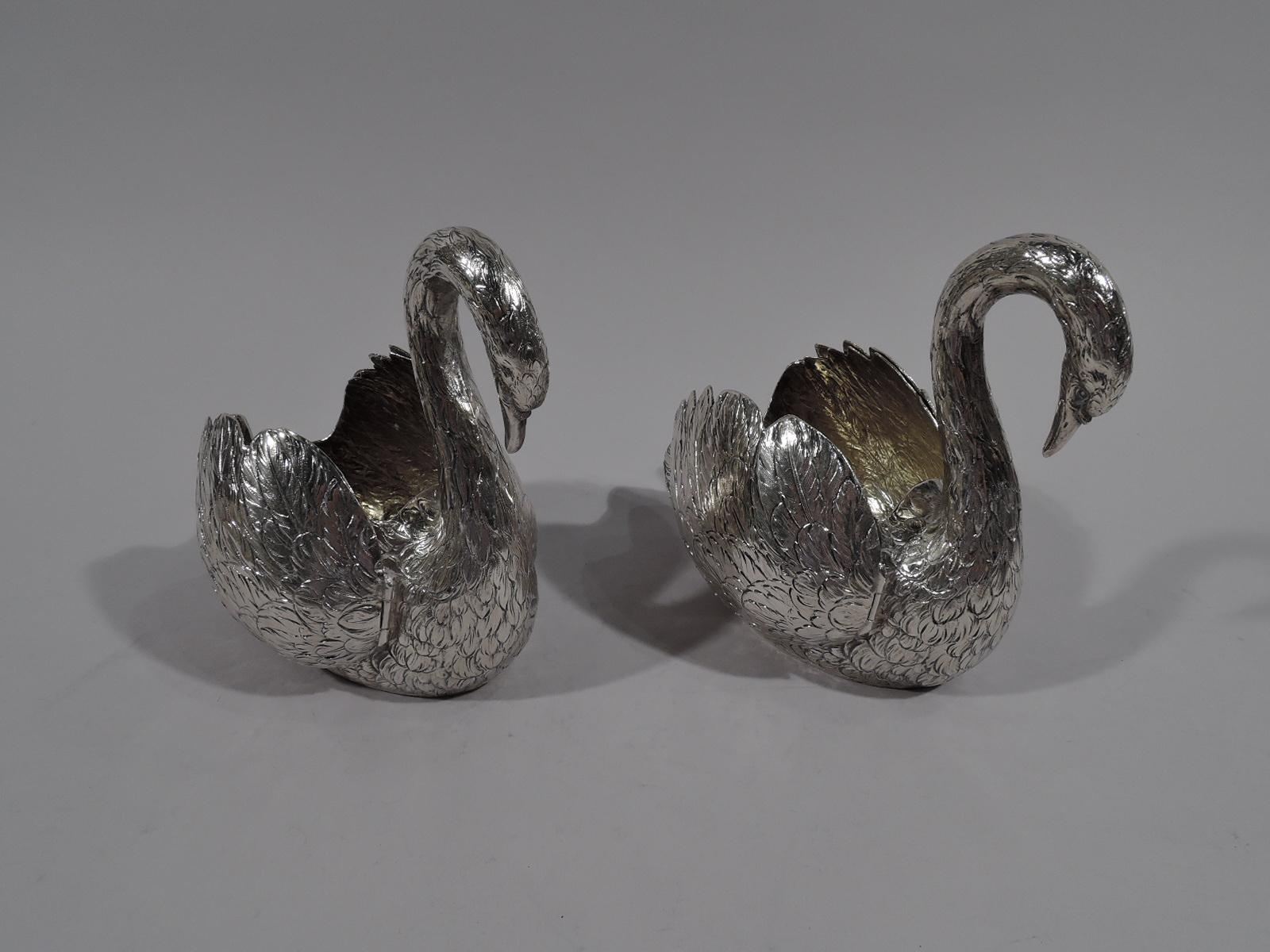 Pair of 800 silver swan bowls. Made by Karl Söhnlein & Söhne in Hanau, German, circa 1930. Each: Round downy bodies with hinged wings and graceful scroll necks. Interior gilt washed. Elegant table ornaments that can filled with treats. Fully