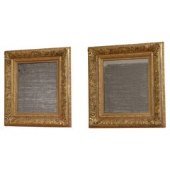 Paire de miroirs muraux anciens dorés, H71 cm