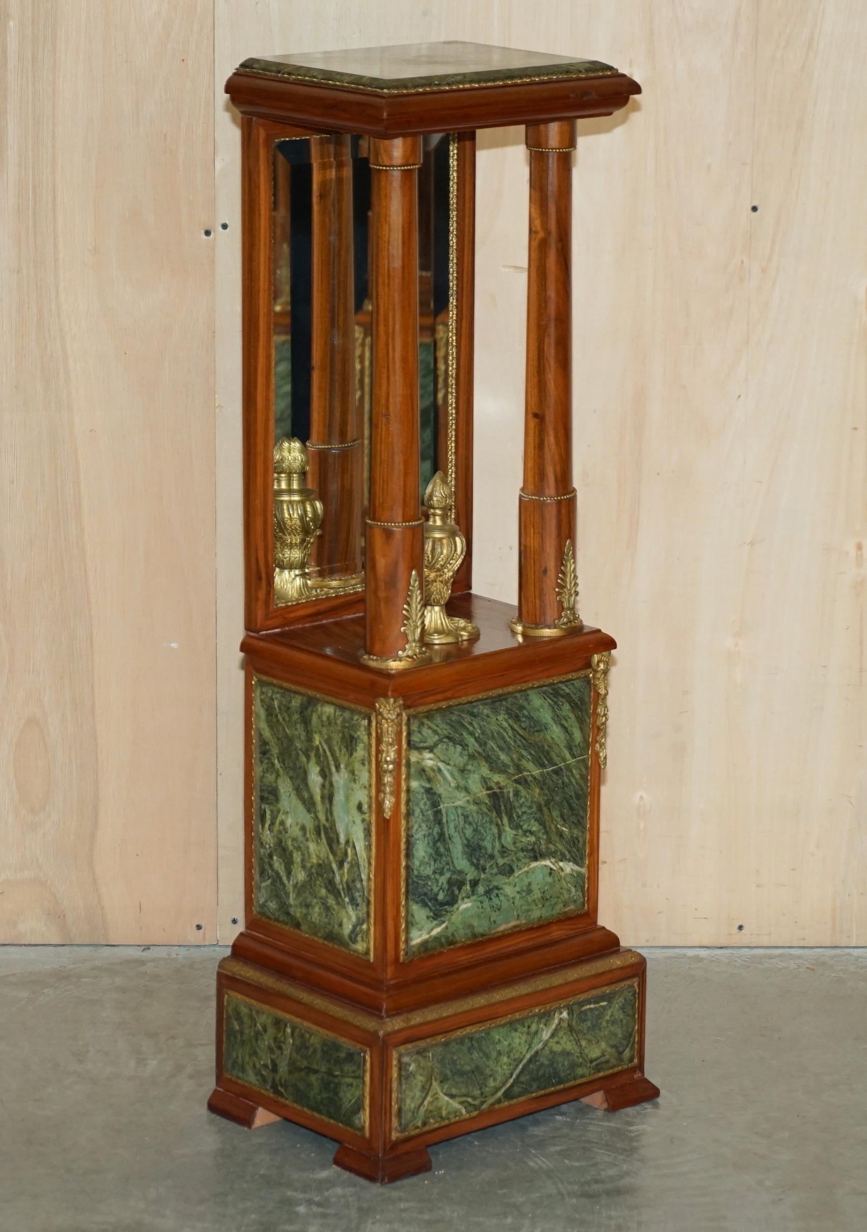 We are delighted to offer for sale this exquisite pair of Walnut, Gold Gilt Bronze mounted pedestals with Italian Green marble tops and mirrored backs circa 1920-1940

These are a highly decorative and well made pair of circa 1920-1940 pedestals.