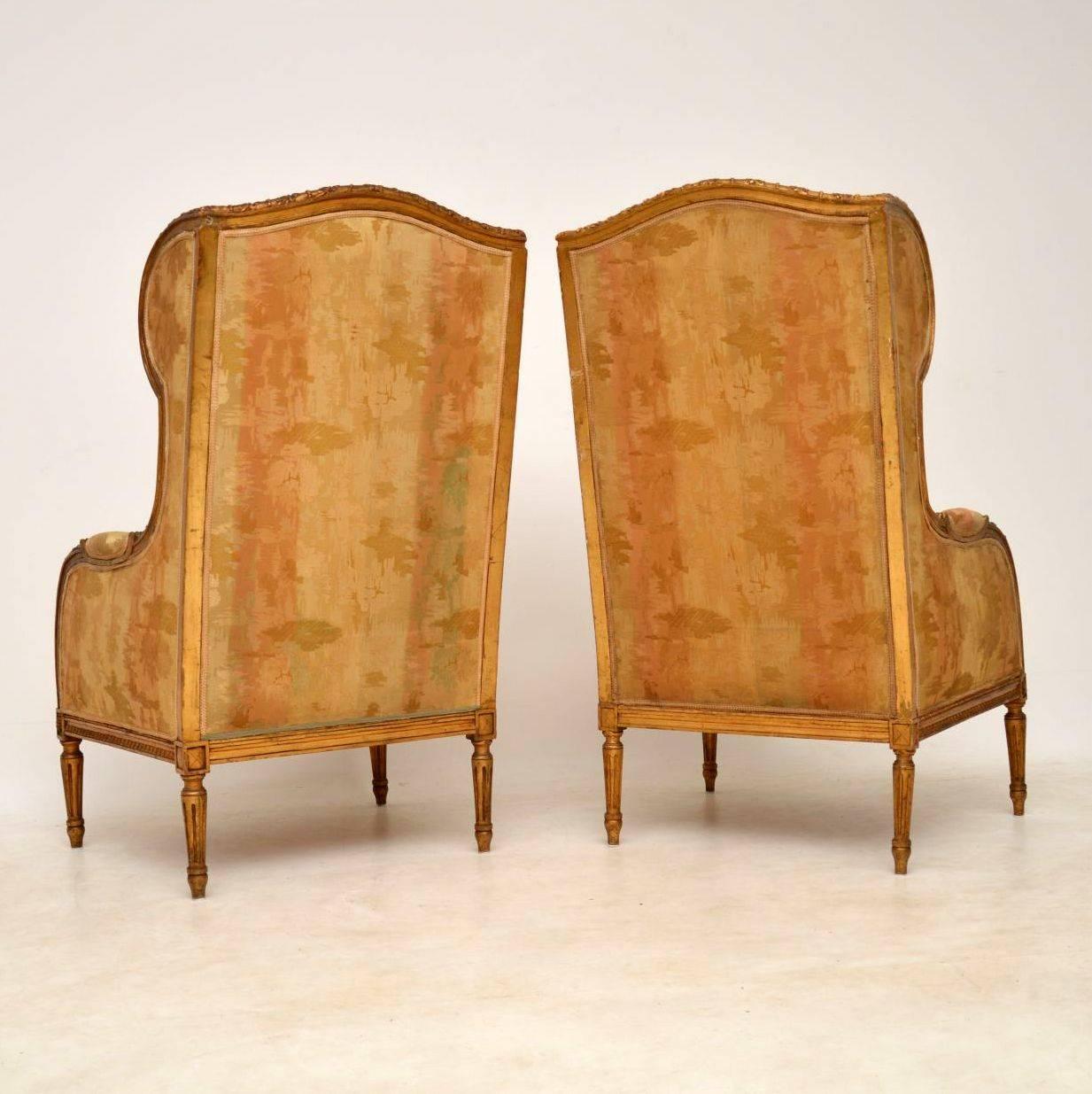 Stunning and rare pair of antique giltwood wing armchairs in original condition with what looks like the original fabric. They do need attention with regards to tightening up the frames, but this can’t be done successfully until they are