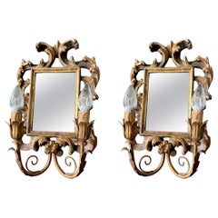 Paire d'appliques anciennes en bois doré avec miroir sculpté