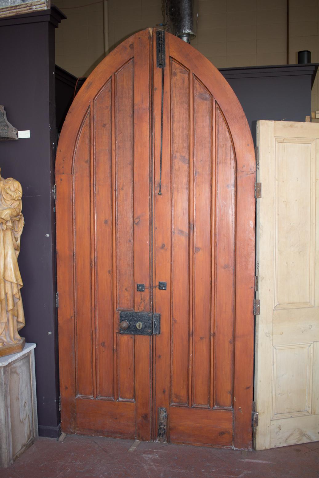 Pair of tall antique Gothic chapel doors with its original hardware.