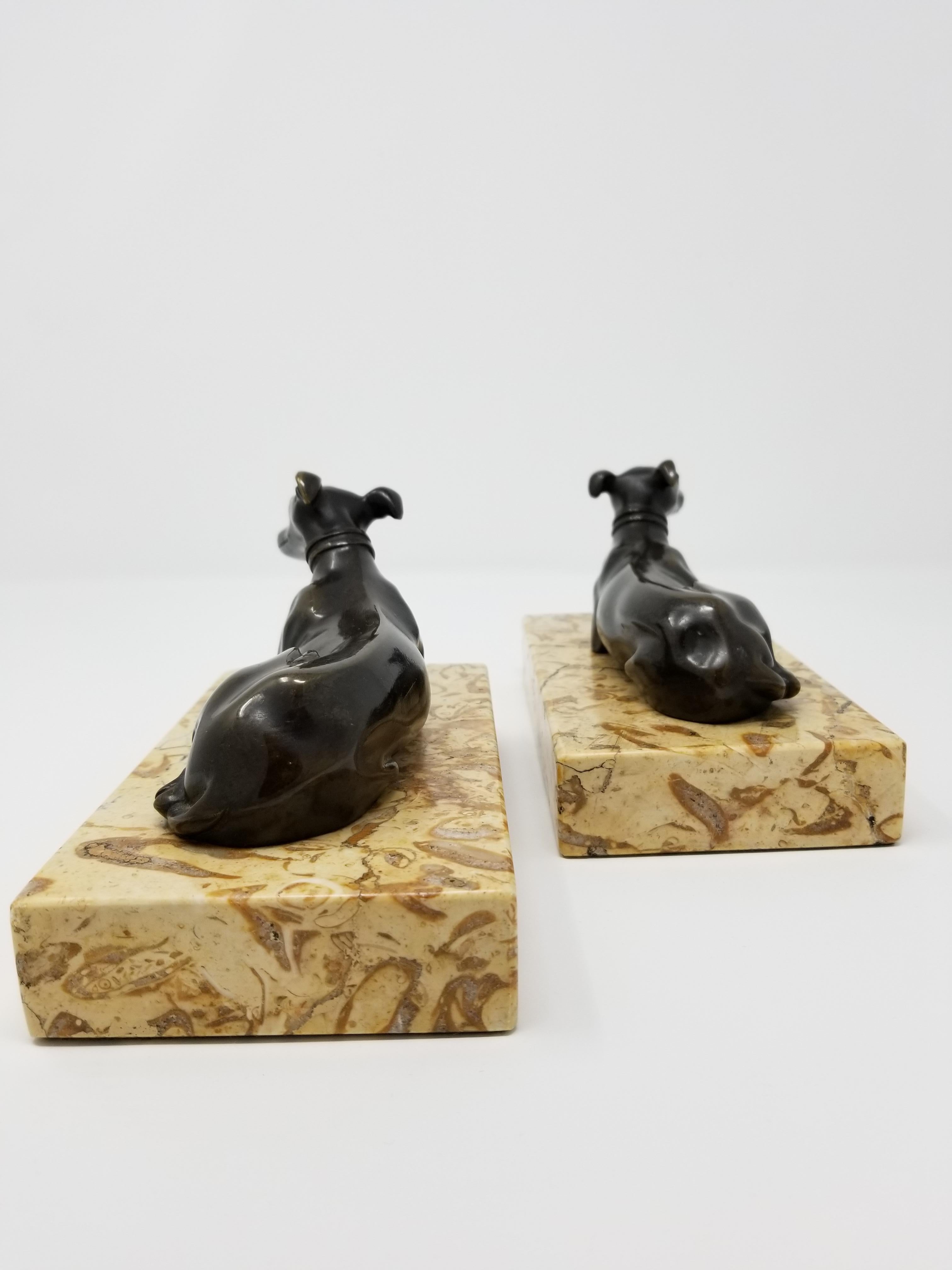 Hand-Carved Pair of Antique Grand Tour Patinated Bronze Grey Hounds Seated Marble Plinths For Sale