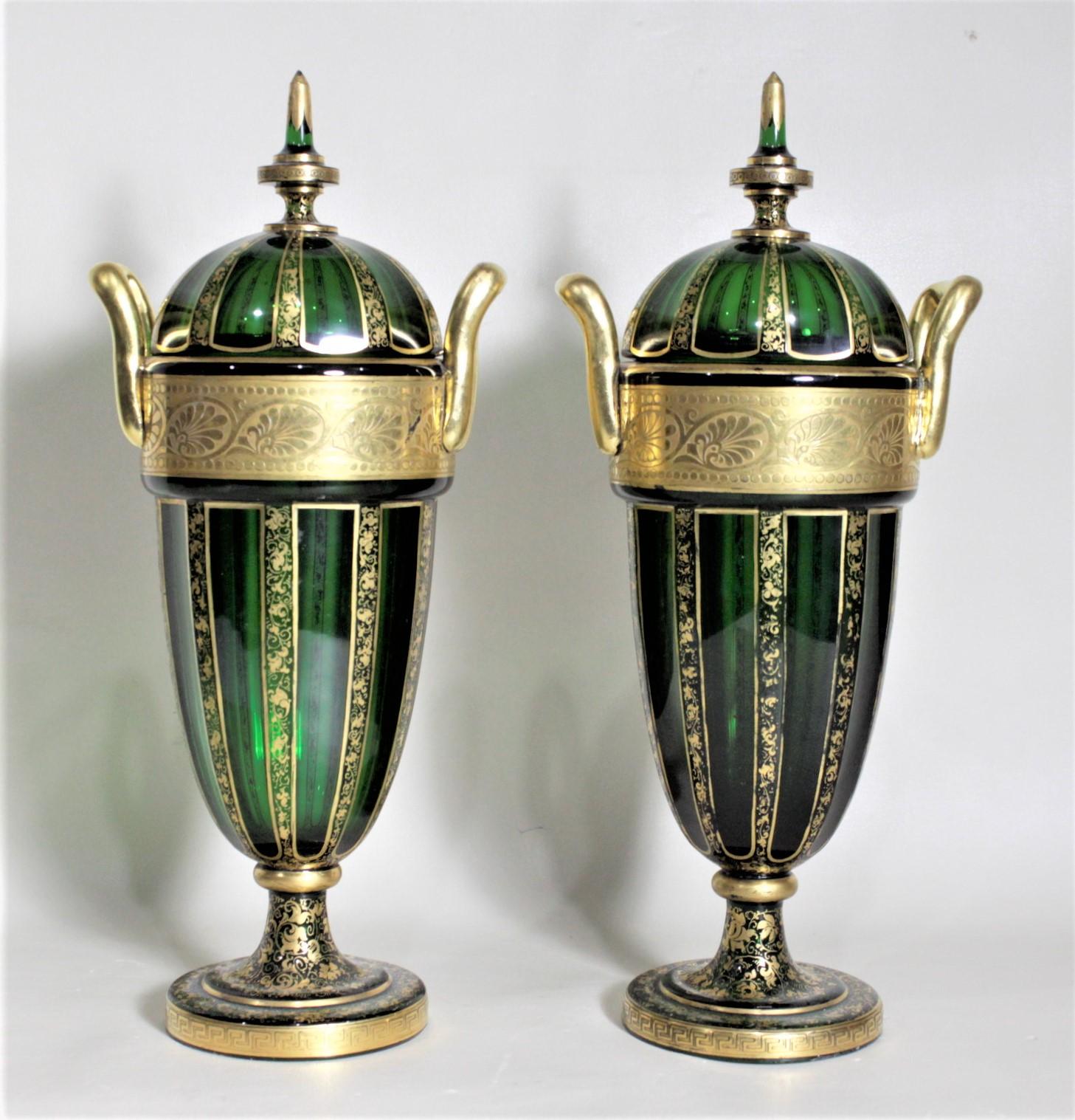 Victorian Pair of Antique Green Bohemian Covered Glass Urns with Heavy Gilt Decoration For Sale