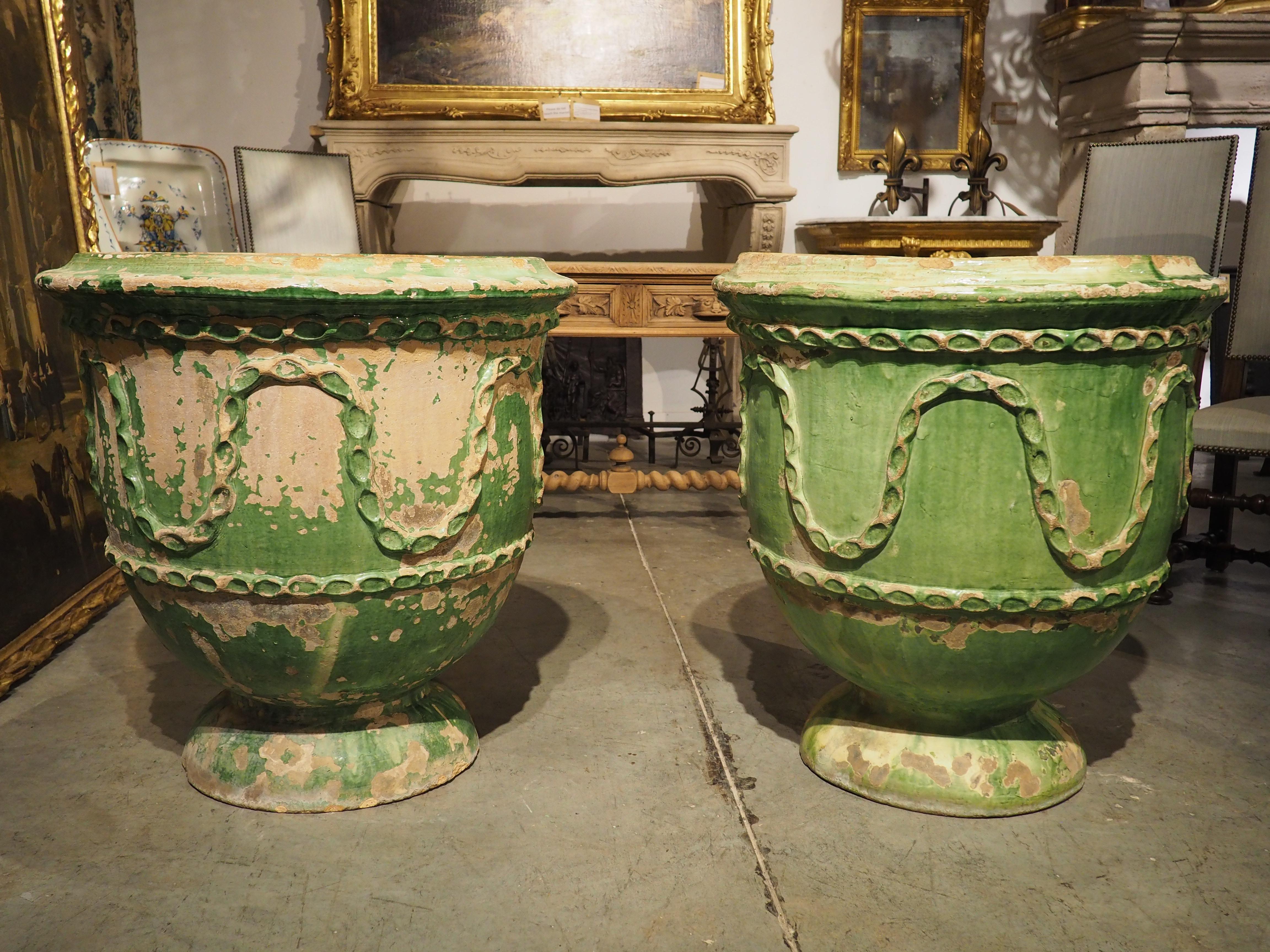 This pair of green glazed terra cotta pots are from the 1800’s from Salon-de-Provence (informally known as Salon). Salon is a commune in the South of France, best known for being the final residence of Nostradamus. Our pair is reminiscent of the