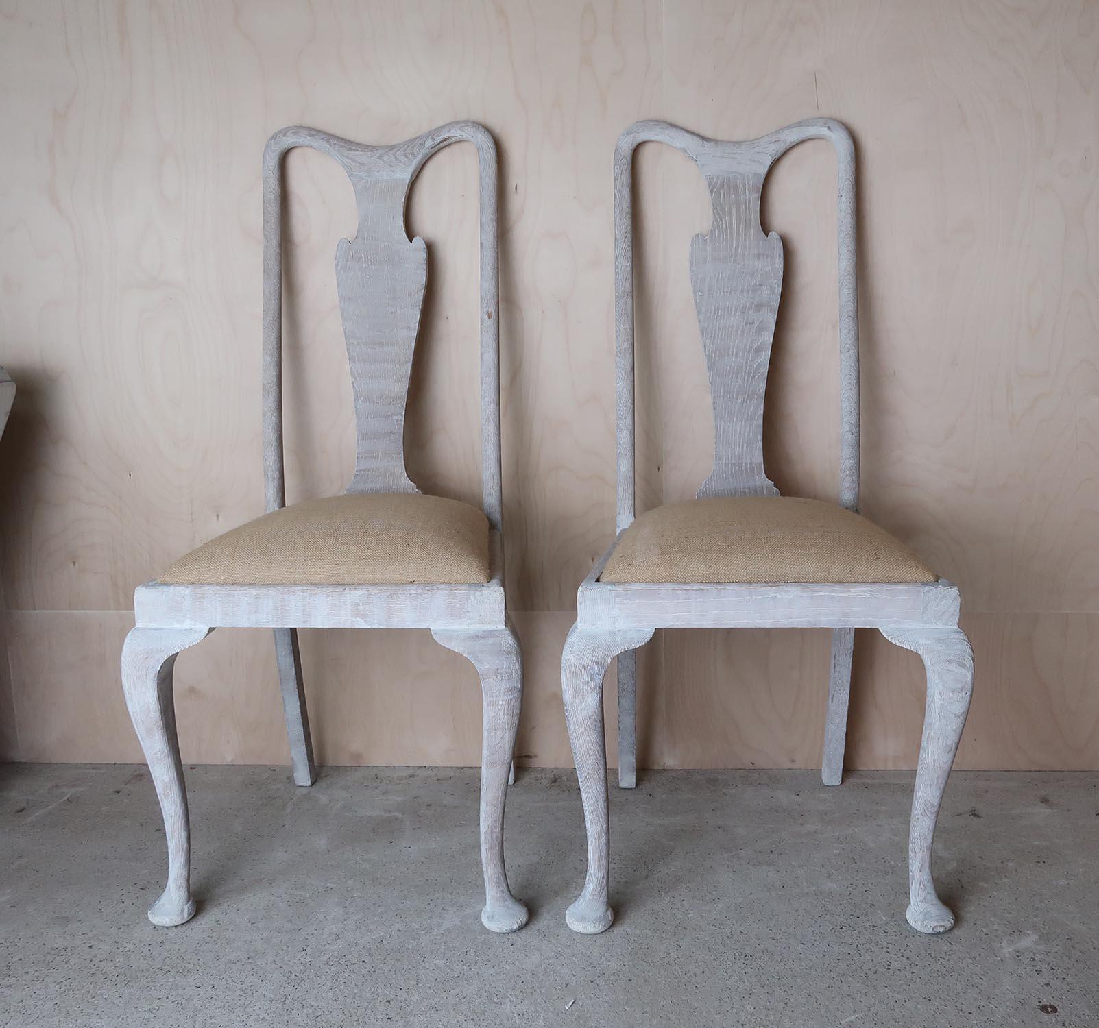 A pair of English limed oak chairs. 

Typical Gustavian style, the chairs have delightful urn back splats, unadorned cabriole or Queen Anne legs and the elegantly understated shaped top-rails.

They have been recently limed to enhance the