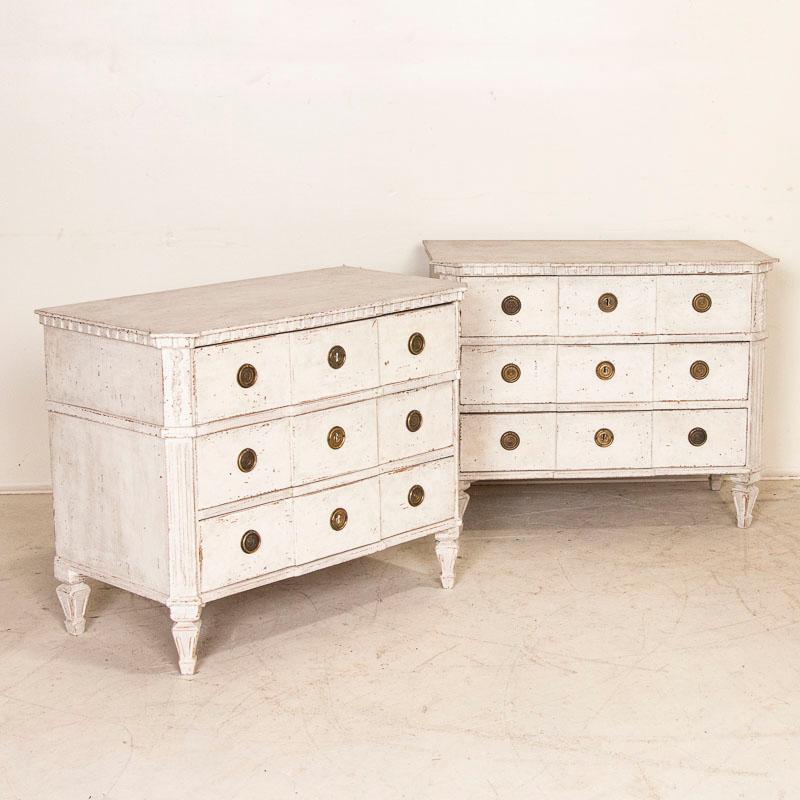 The classic gustavian style of this lovely pair of chest of drawers is revealed in the exquisite details. Enlarge the photos to appreciate the canted sides, carved feet and upper dental molding. It is the captivating (newer) painted finish that adds