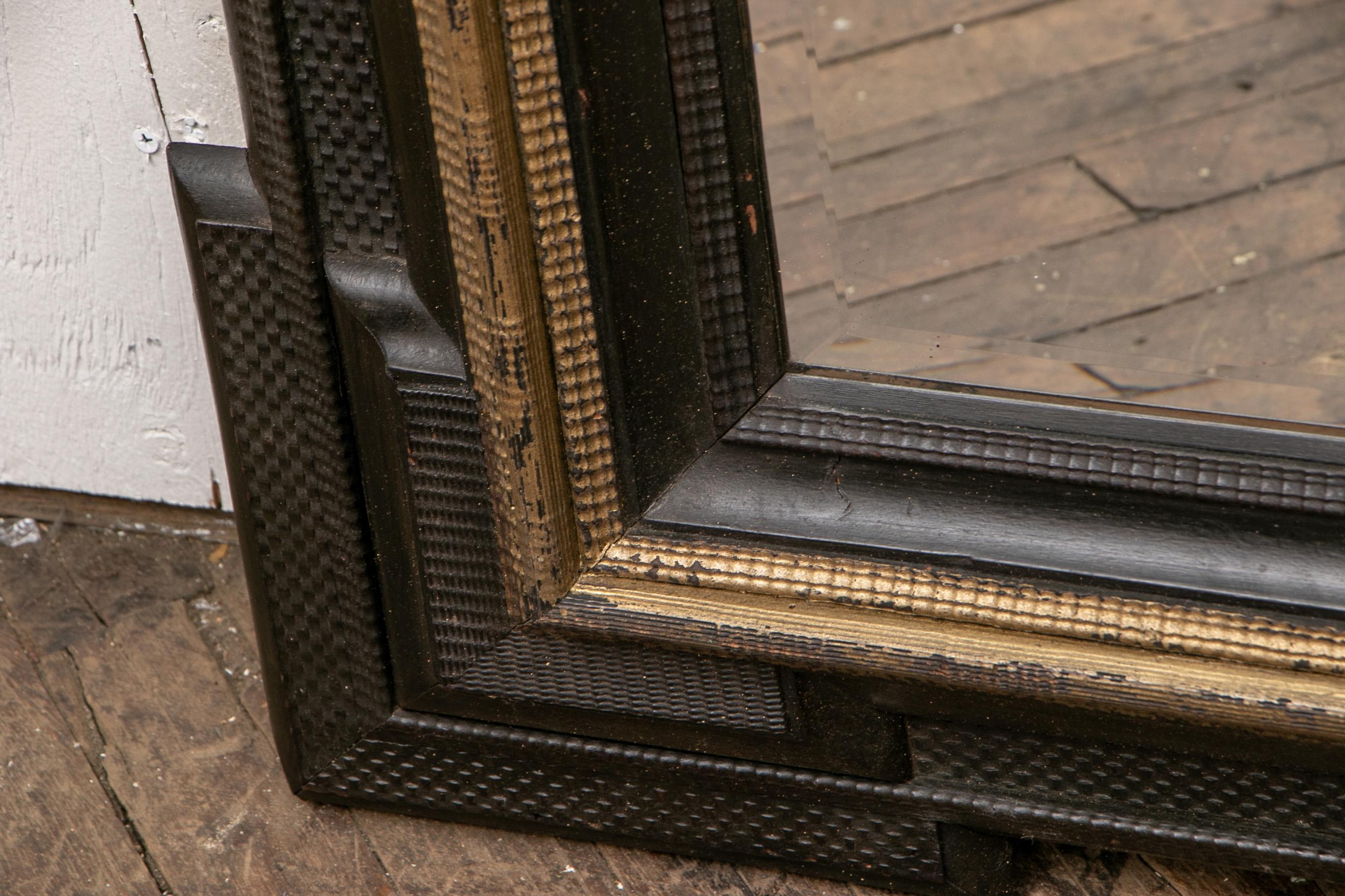 Pair of Antique Hand Carved, Ebonized and Gilt Frames Set with Mirrors In Good Condition In Bridgeport, CT