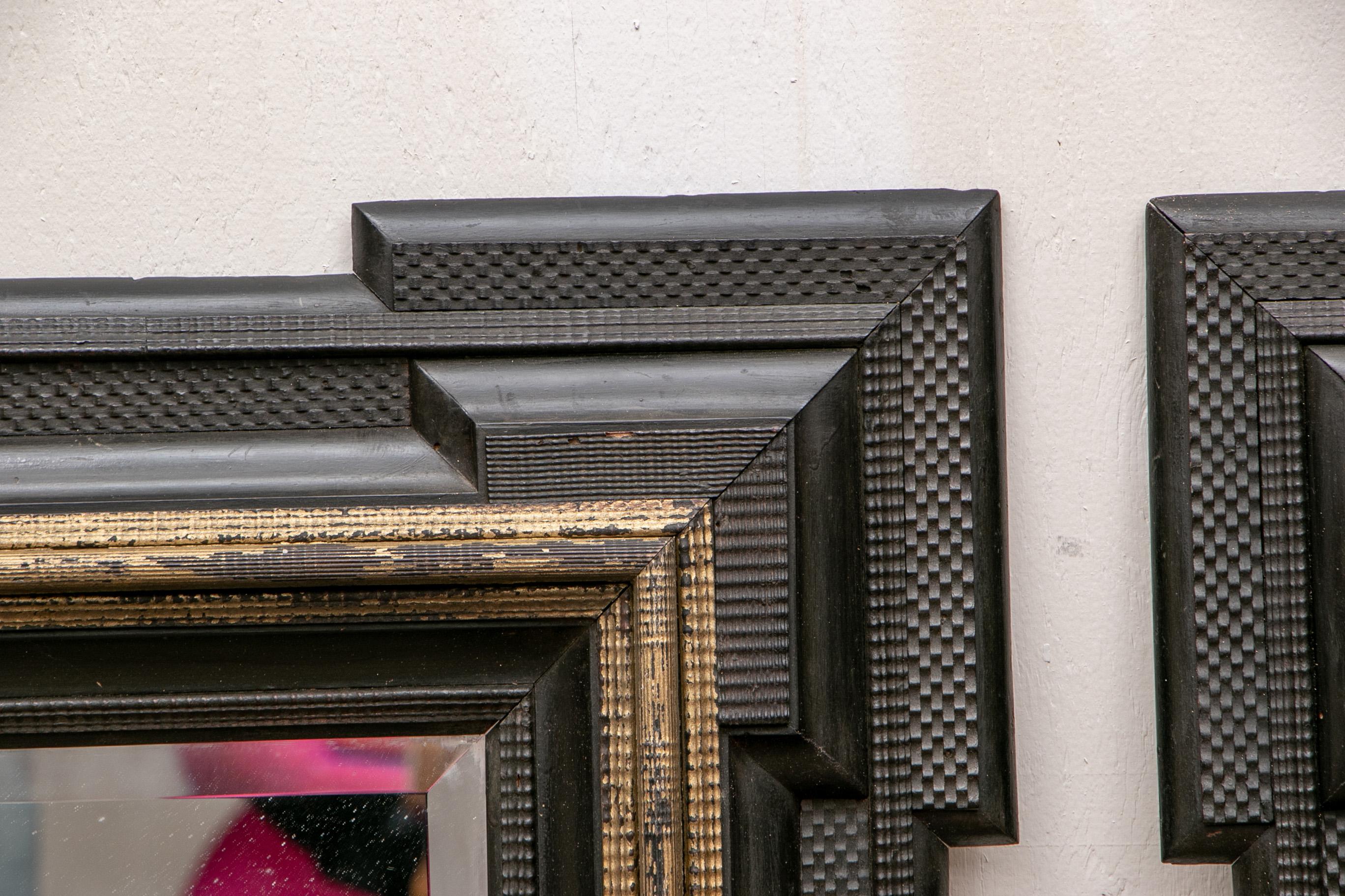 Wood Pair of Antique Hand Carved, Ebonized and Gilt Frames Set with Mirrors