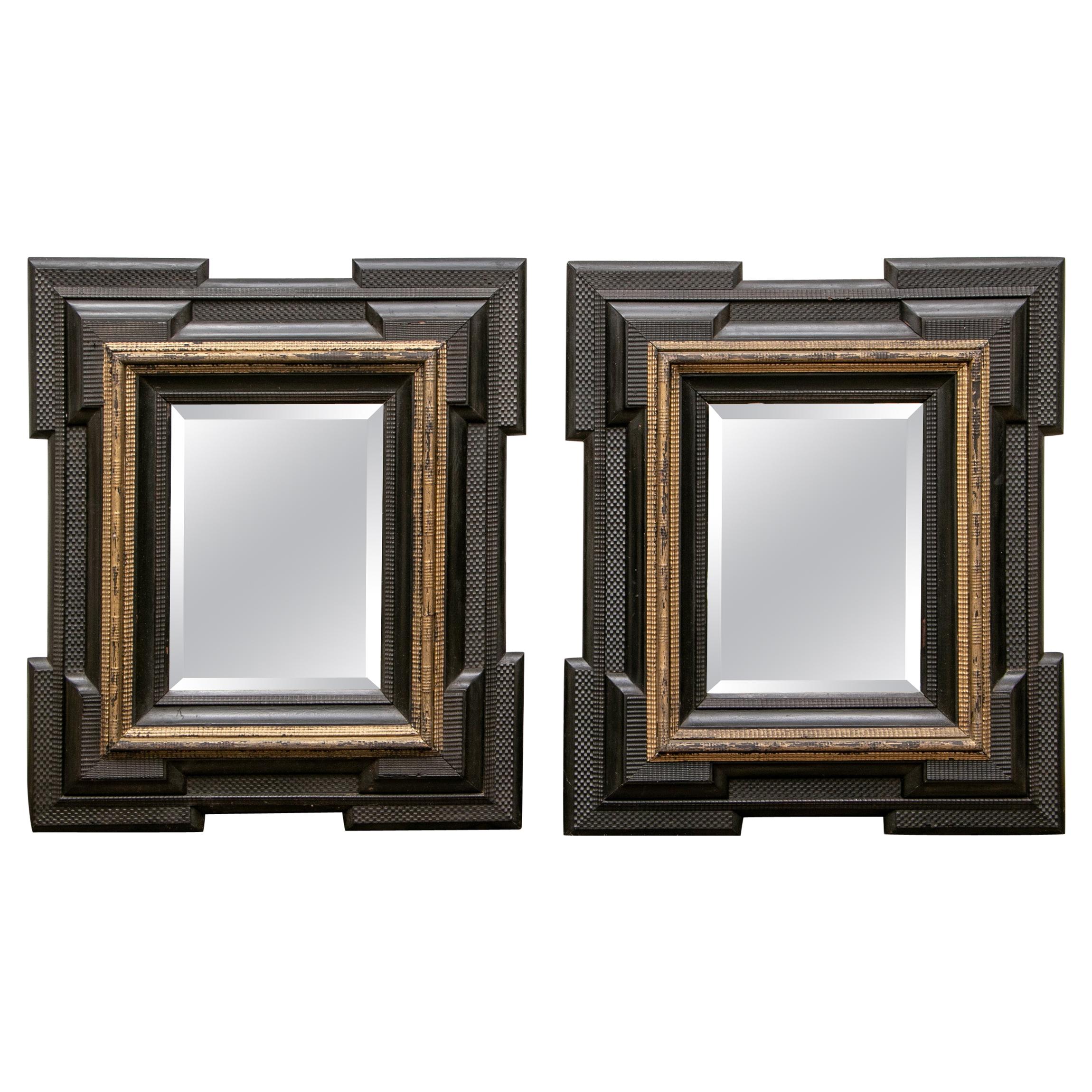 Pair of Antique Hand Carved, Ebonized and Gilt Frames Set with Mirrors