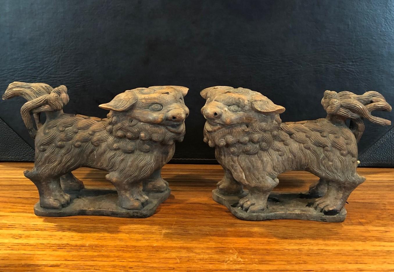 Pair of Antique Hand Carved Hard Wood Chinese Foo Dogs In Good Condition For Sale In San Diego, CA