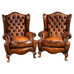 Pair of Antique Hand Dyed Leather Wing Back Armchairs