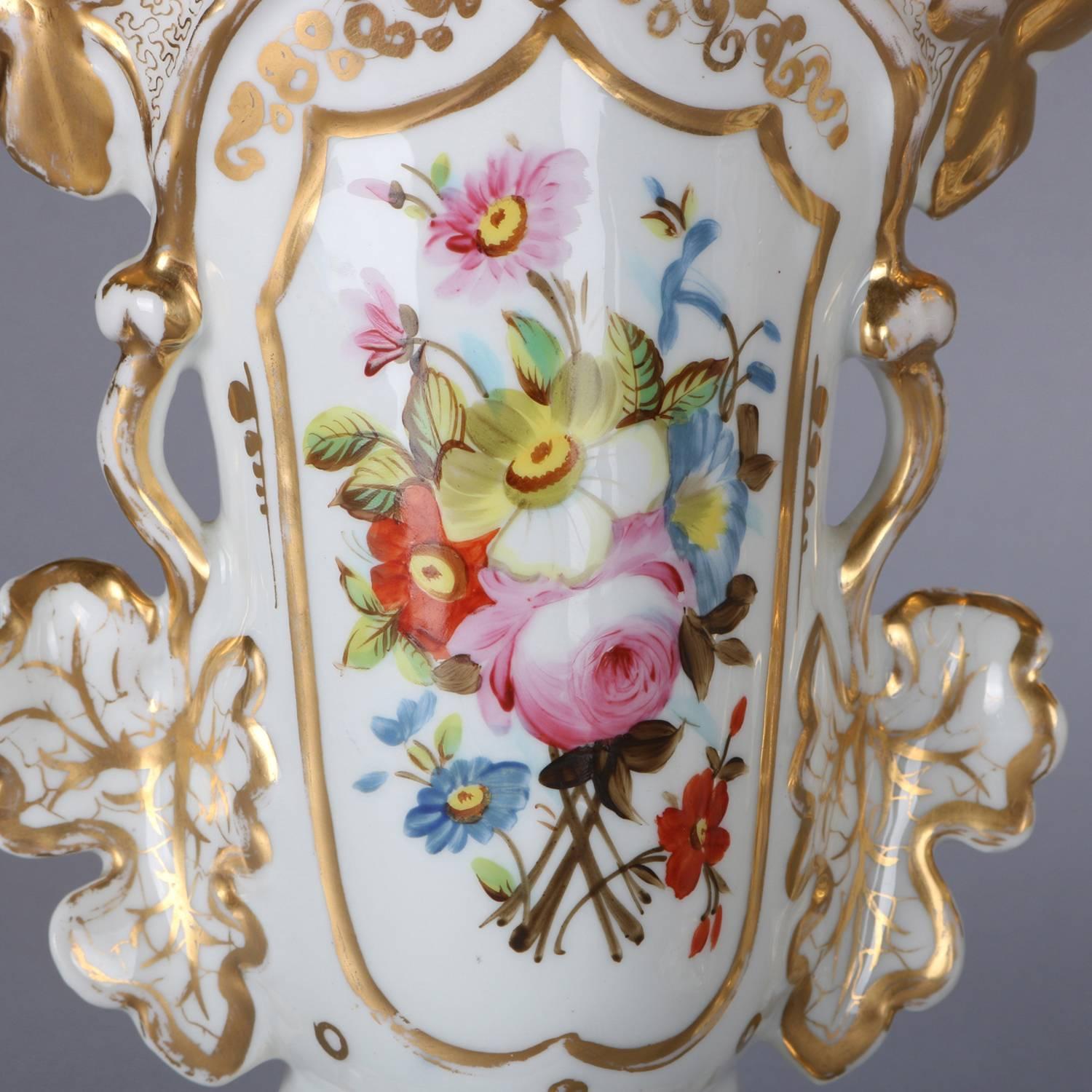 Pair of French Old Paris spill vases feature porcelain construction with shaped and fanned mouth over vessel with hand painted floral reserves with gilt highlights throughout, marked on base, 19th century.

Measures - 9.75