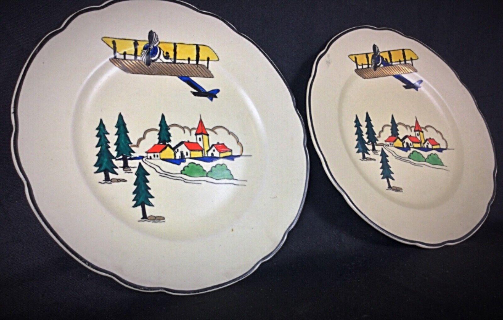 Enhance your collection with this charming pair of antique Longwy plates, each featuring the delightful 