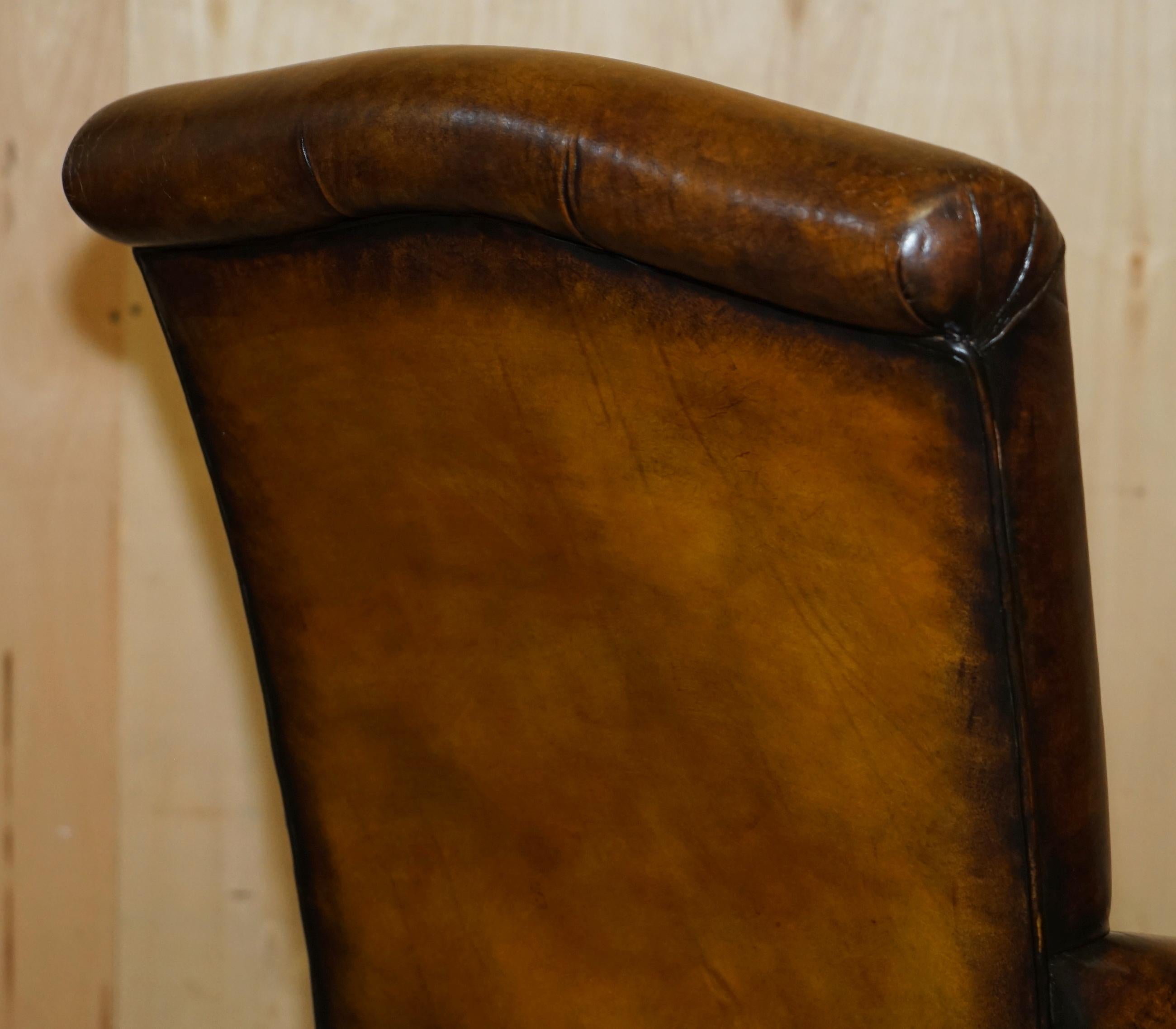 PAIR OF ANTIQUE HEAVILY CARVED HAND DYED BROWN LEATHER RESTORED THRONE ARMCHAIRs For Sale 7