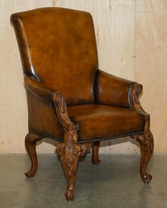 PAIR OF ANTIQUE HEAVILY CARved HAND DYED BROWN LEATHER RESTORED THRONE ARMCHAIRs