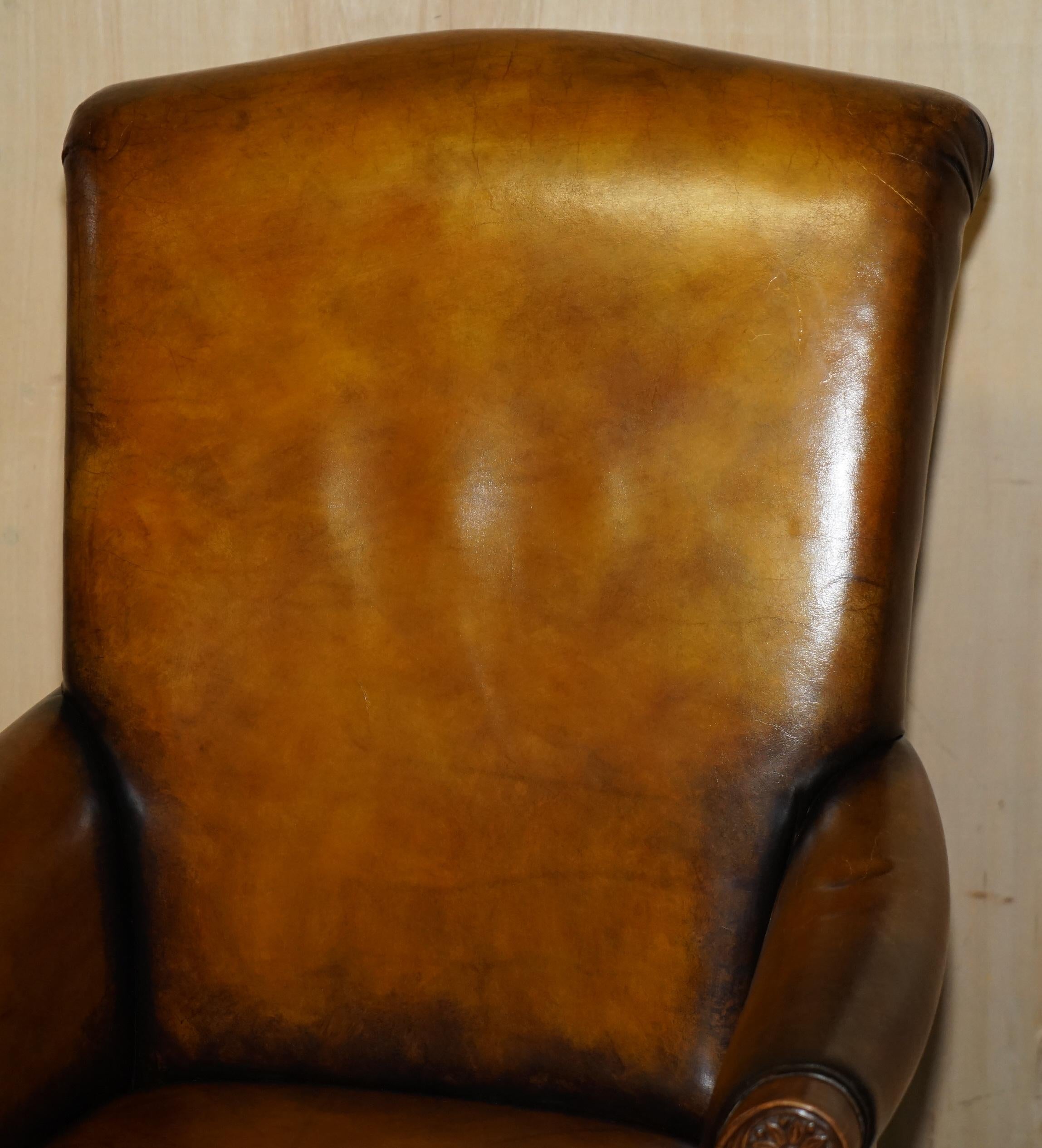 English PAIR OF ANTIQUE HEAVILY CARVED HAND DYED BROWN LEATHER RESTORED THRONE ARMCHAIRs For Sale