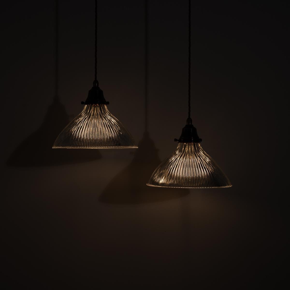 British Pair of Antique Holophane Pendant Lights with Aged Copper Fittings