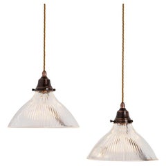 Pair of Antique Holophane Pendant Lights with Aged Copper Fittings