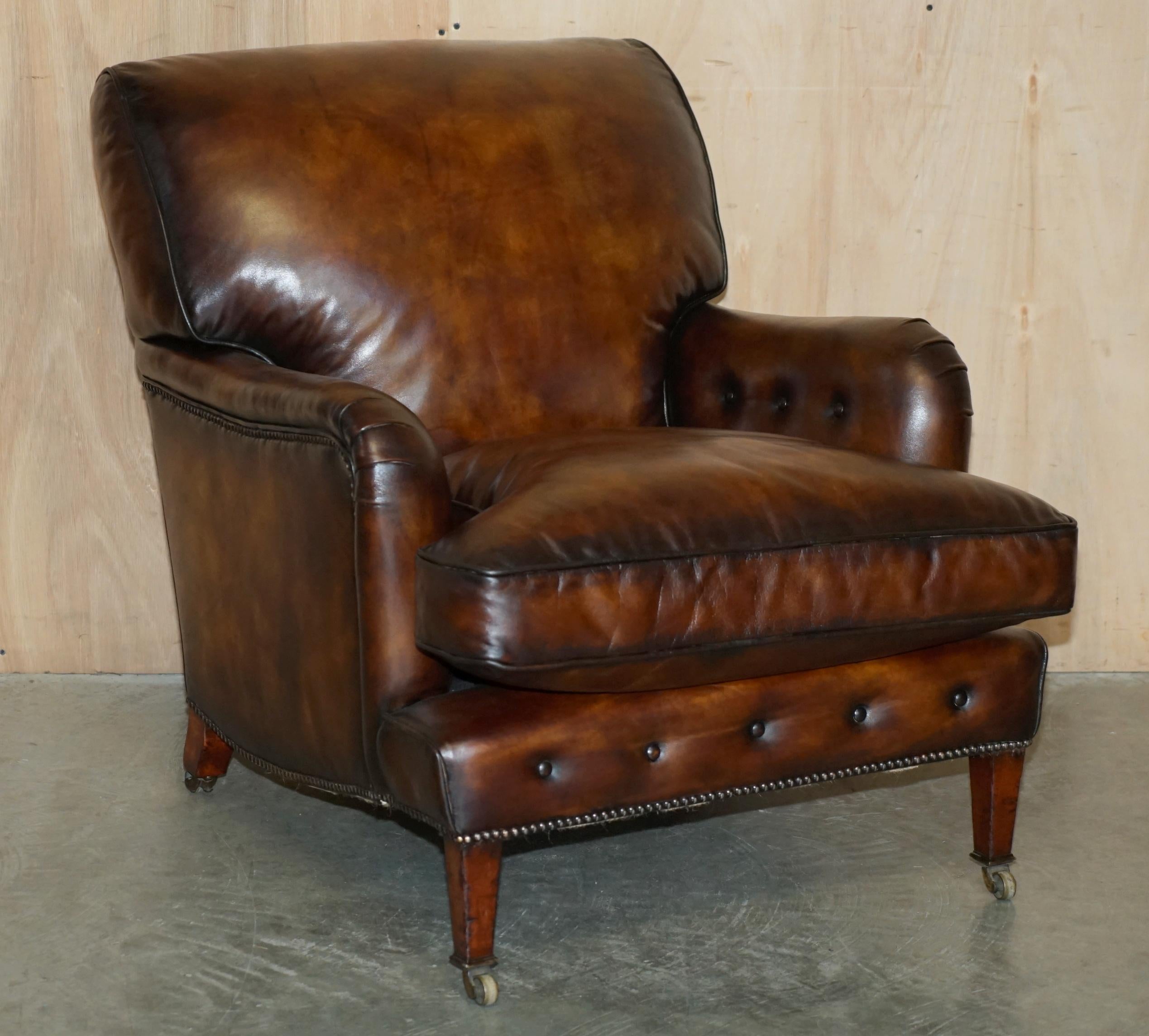 High Victorian PAIR OF ANTIQUE HOWARD & SON's BRIDGEWATER BROWN LEATHER ARMCHAiRS & FOOTSTOOL For Sale