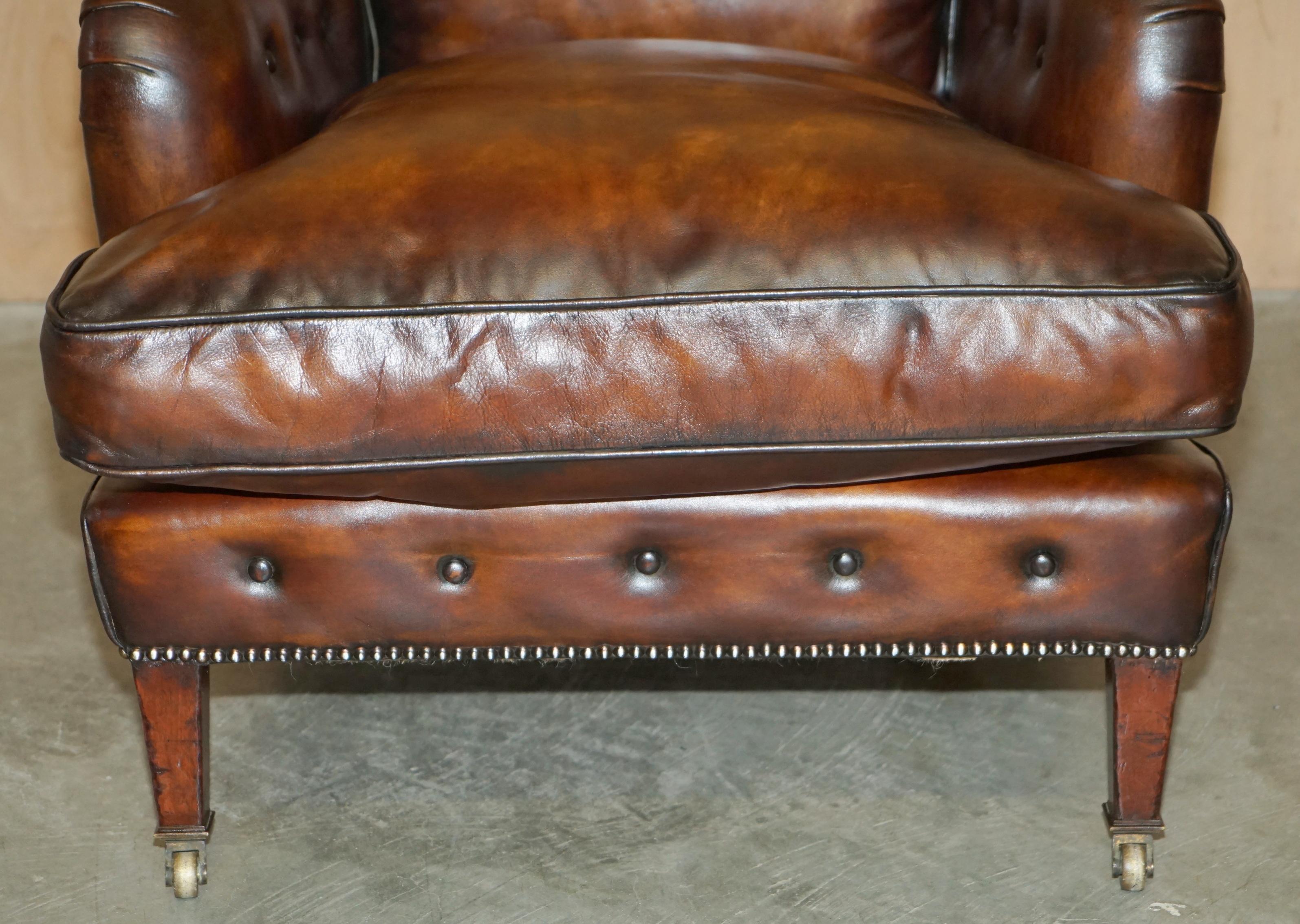 Late 19th Century PAIR OF ANTIQUE HOWARD & SON's BRIDGEWATER BROWN LEATHER ARMCHAiRS & FOOTSTOOL For Sale