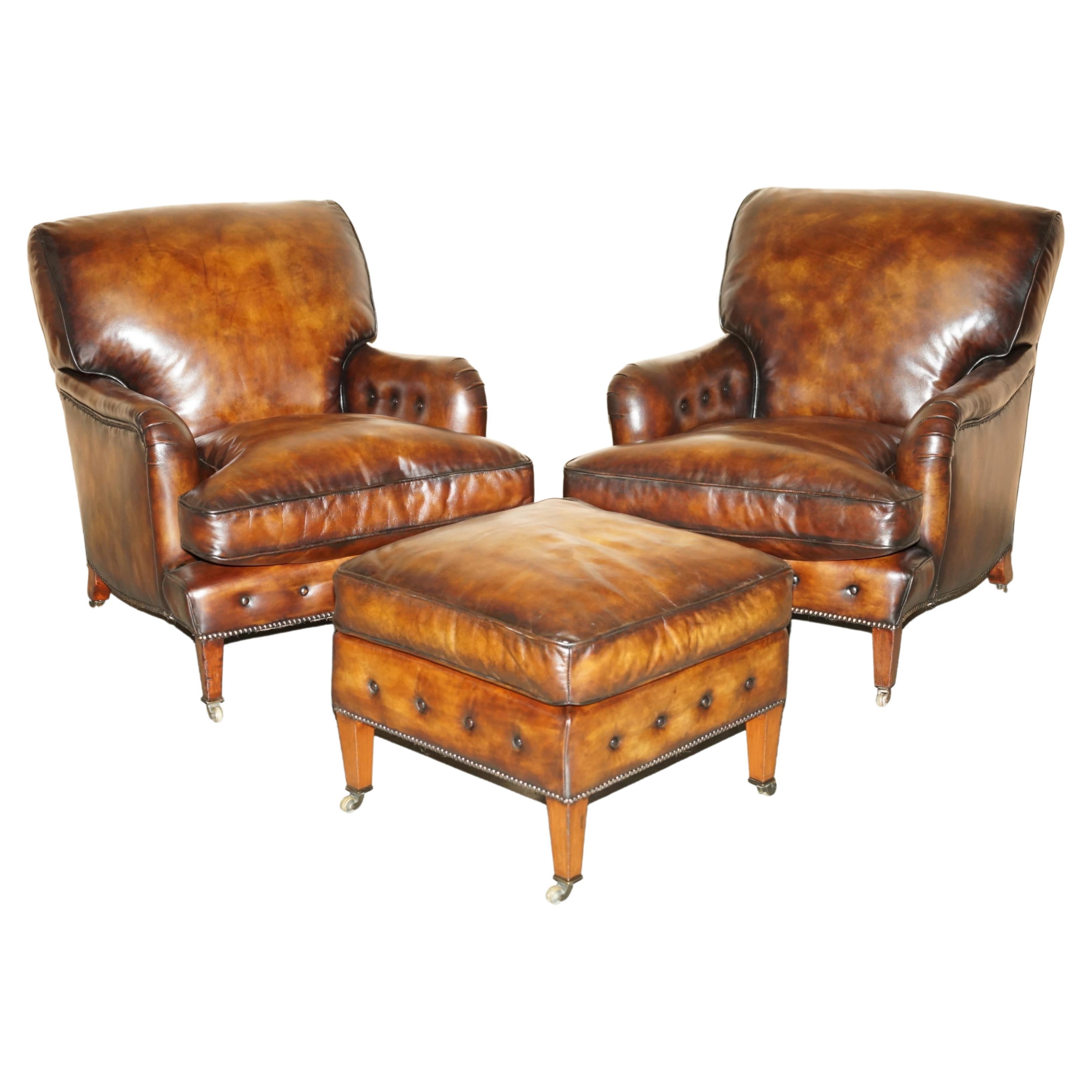 PAIR OF ANTIQUE HOWARD & SON's BRIDGEWATER BROWN LEATHER ARMCHAiRS & FOOTSTOOL