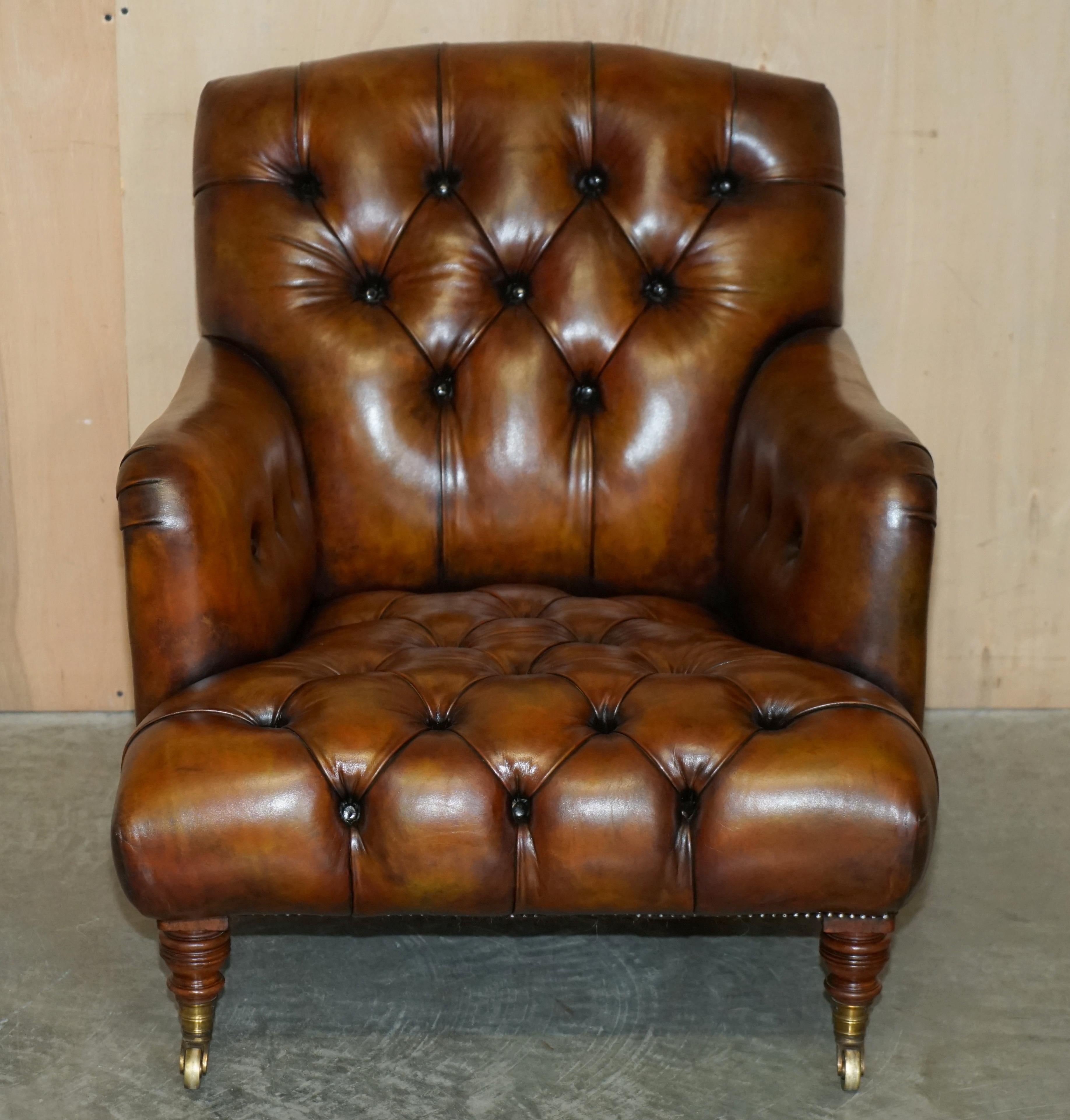 Hand-Crafted Pair of Antique Howard & Son's Bridgewater Brown Leather Chesterfield Armchairs For Sale