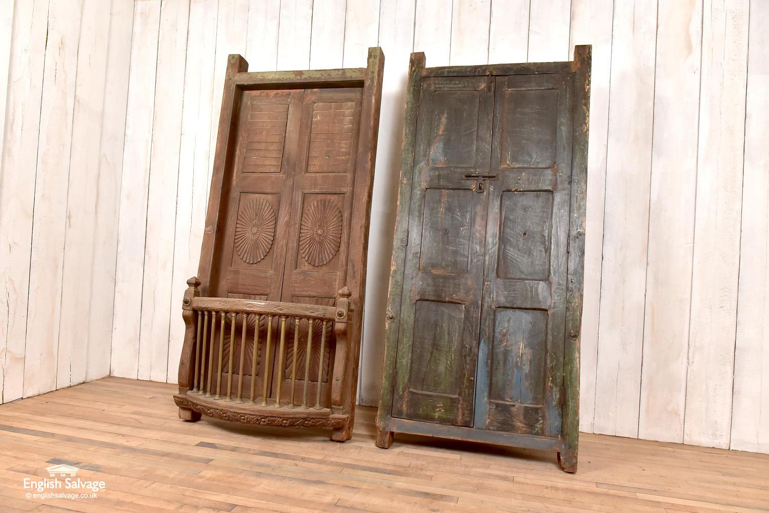 Two matching pairs of teak balcony windows/shutters/doors. The balcony fronts could be removed by the purchaser as they attach to the front of the frame, although there will presumably some marks/holes where these detach. Nice carved detail to the