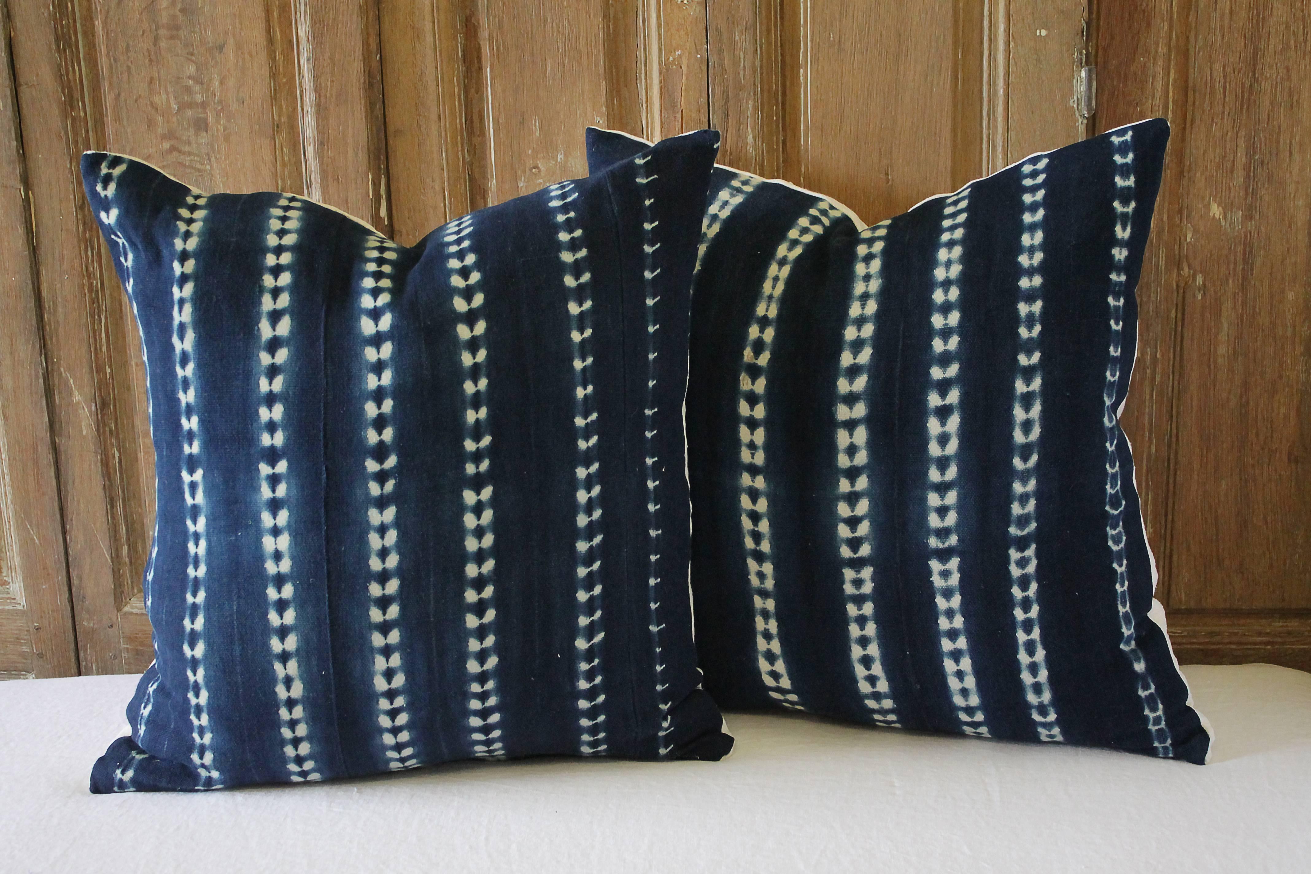 Pair of antique indigo blue Batik accent pillows
Custom-made by Full Bloom Cottage, the fronts of the pillows are in an antique Batik fabric, very soft and nubby, the backside are finished in a thick natural French linen, with hidden zipper closure.