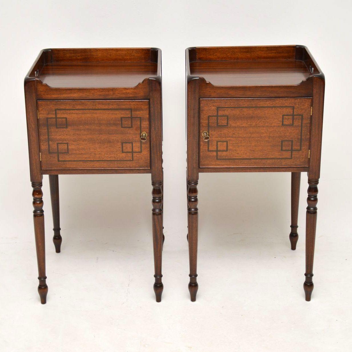 Pair of fine quality mahogany bedside cabinets in the antique Georgian style with ebony inlays on the doors. I think they date from around the 1950s-1960s period, however they certainly have a good period look and are very well made. They have tray