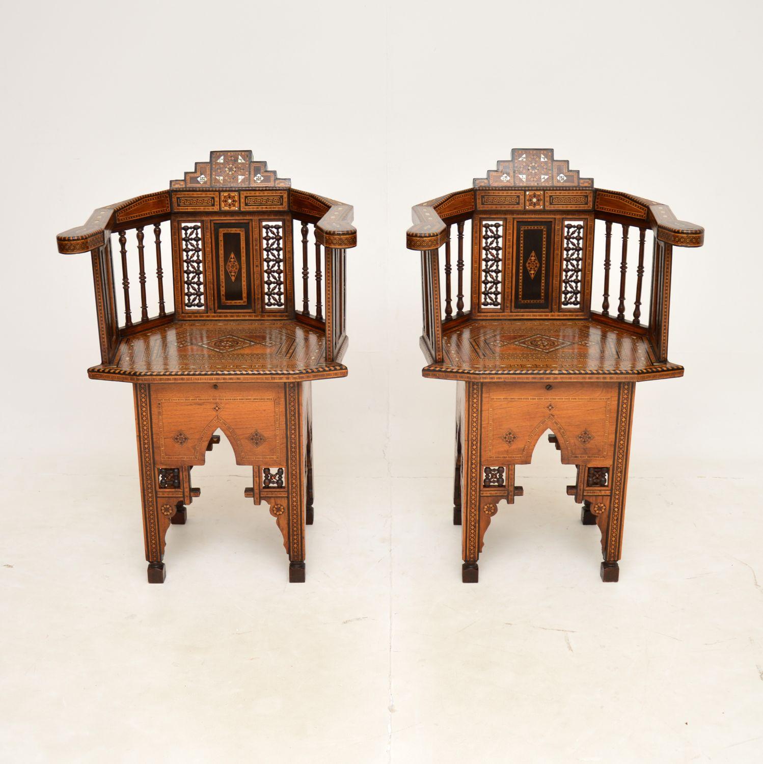 A stunning pair of antique Syrian Damascus armchairs, dating from around the 1900-1920 period.

They are of extremely high quality, with absolutely stunning inlay throughout of various woods and mother of pearl. The inlaid geometric patterns are