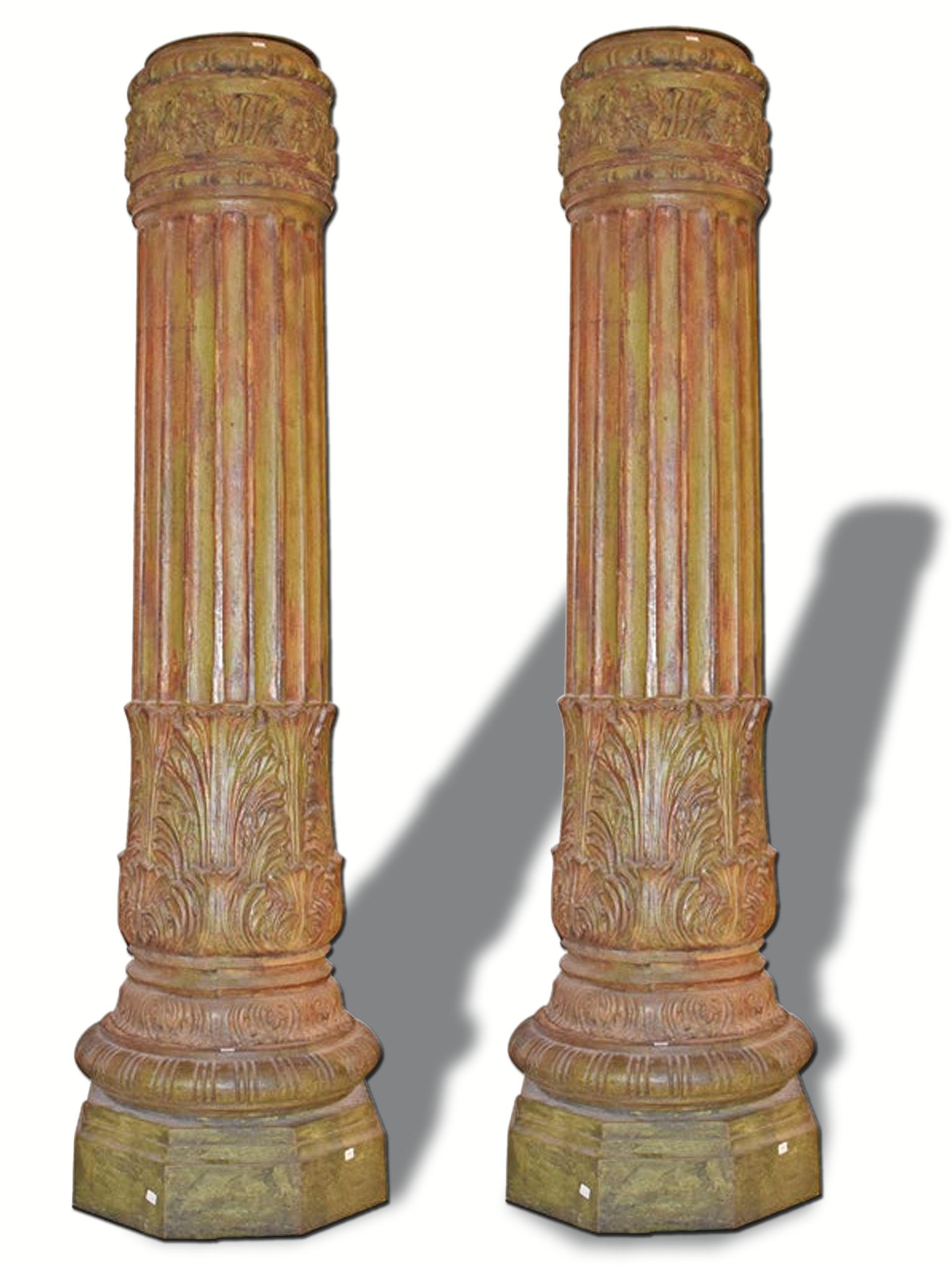 Magnificent pair of antique fluted French iron columns with floral decoration, measures: 77 inches tall, octagonal base is 20 inches x 20 inches.