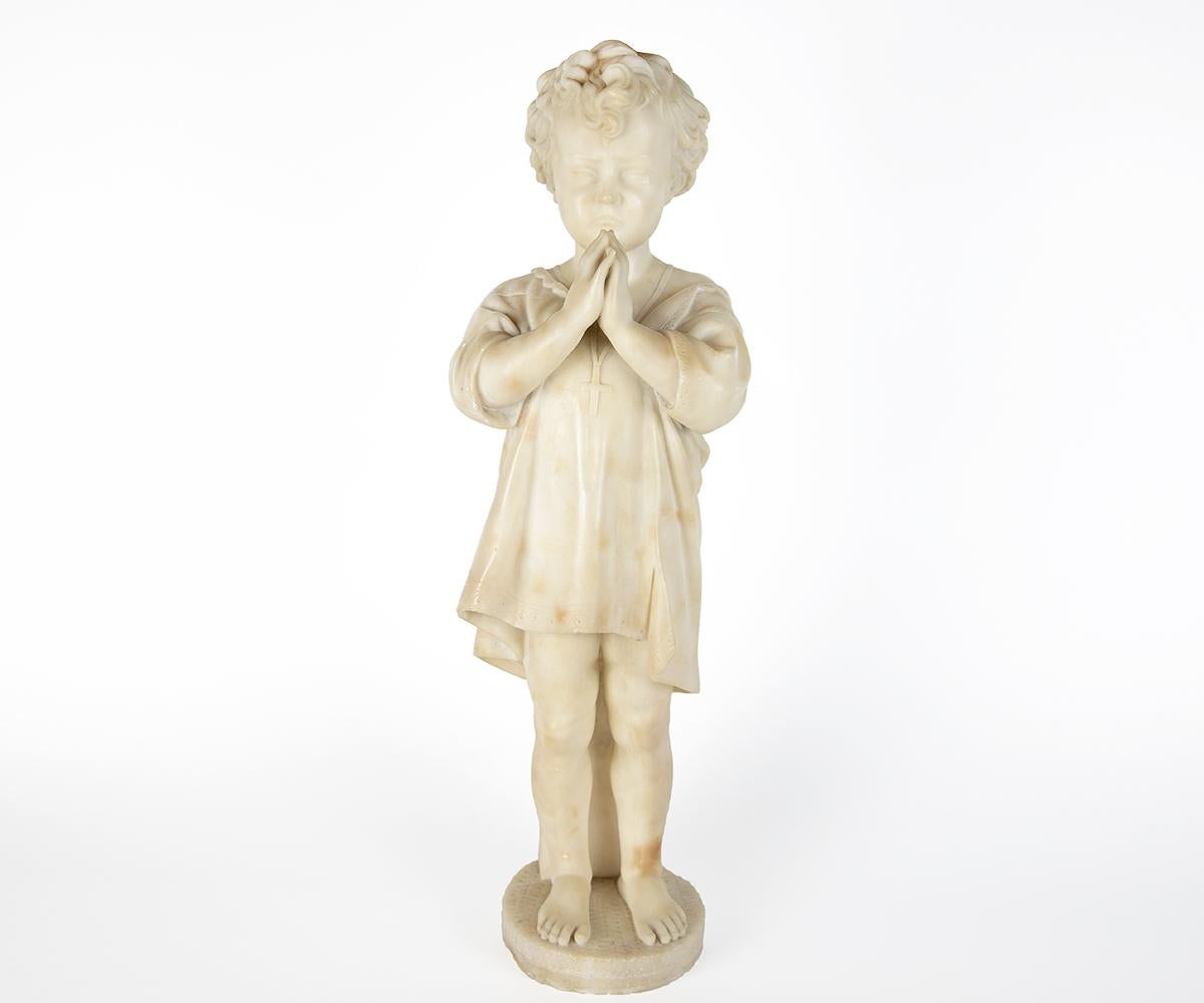 A stunning carved Italian antique alabaster figurines of two siblings. This heartwarming sculpture depicts a the little girl sadden by her personal bowl being broken in half as her little brother tries counseling her with a beautiful prayer.
Little