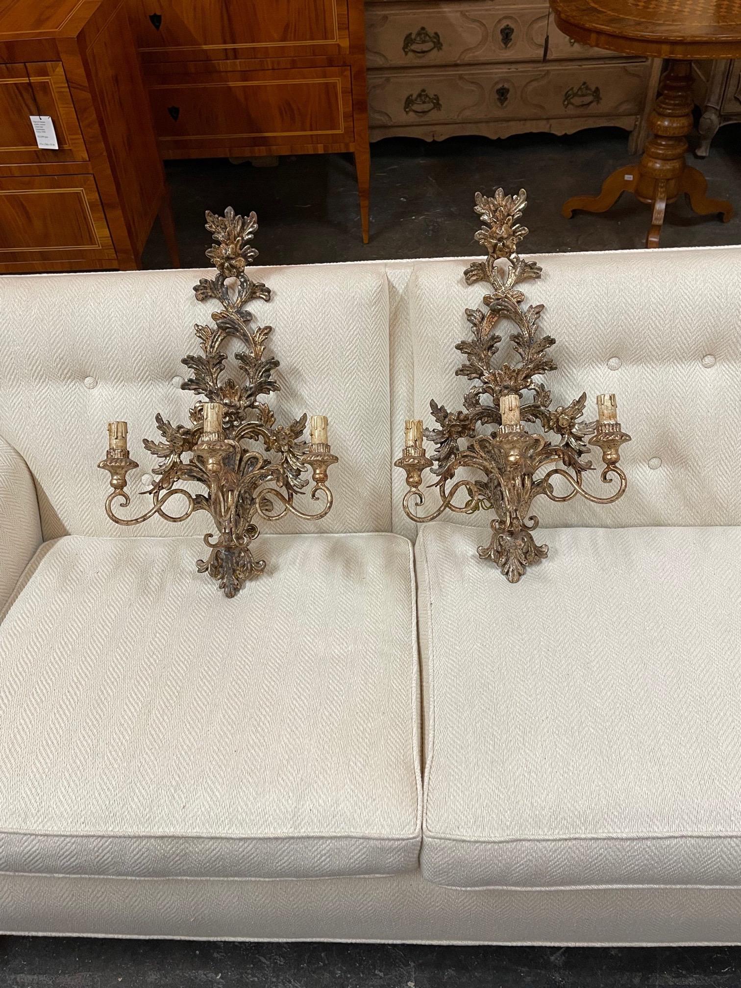 Elegant pair of Italian carved wood and polychromed wall sconces with 3 lights. Nicely carved and lovely scale and shape. A fine pair!