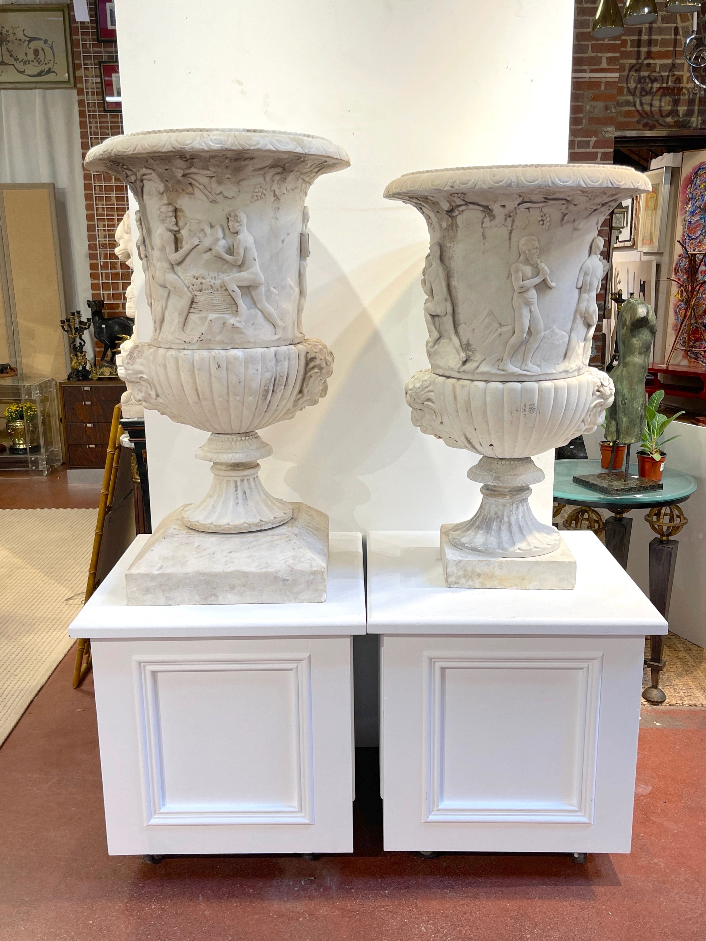 Pair of Antique Italian Marble Bacchanalian Garden Urns
19th Century or Older
After the Roman Antiquity, influences of the Medici and Borghese Vases

We are pleased to offer this remarkable pair of Antique (19th Century or Older) Italian Marble