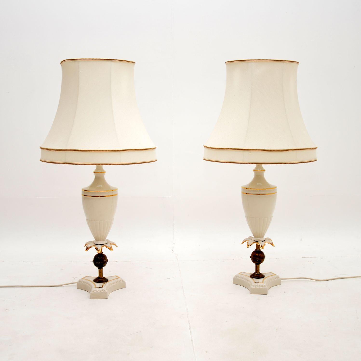 A beautiful pair of antique Italian ceramic table lamps. They were made in Italy and date from around the 1950-60’s.

The quality is fantastic, they are beautifully made with a gorgeous design. The white ceramic stands have gold embellishment, and