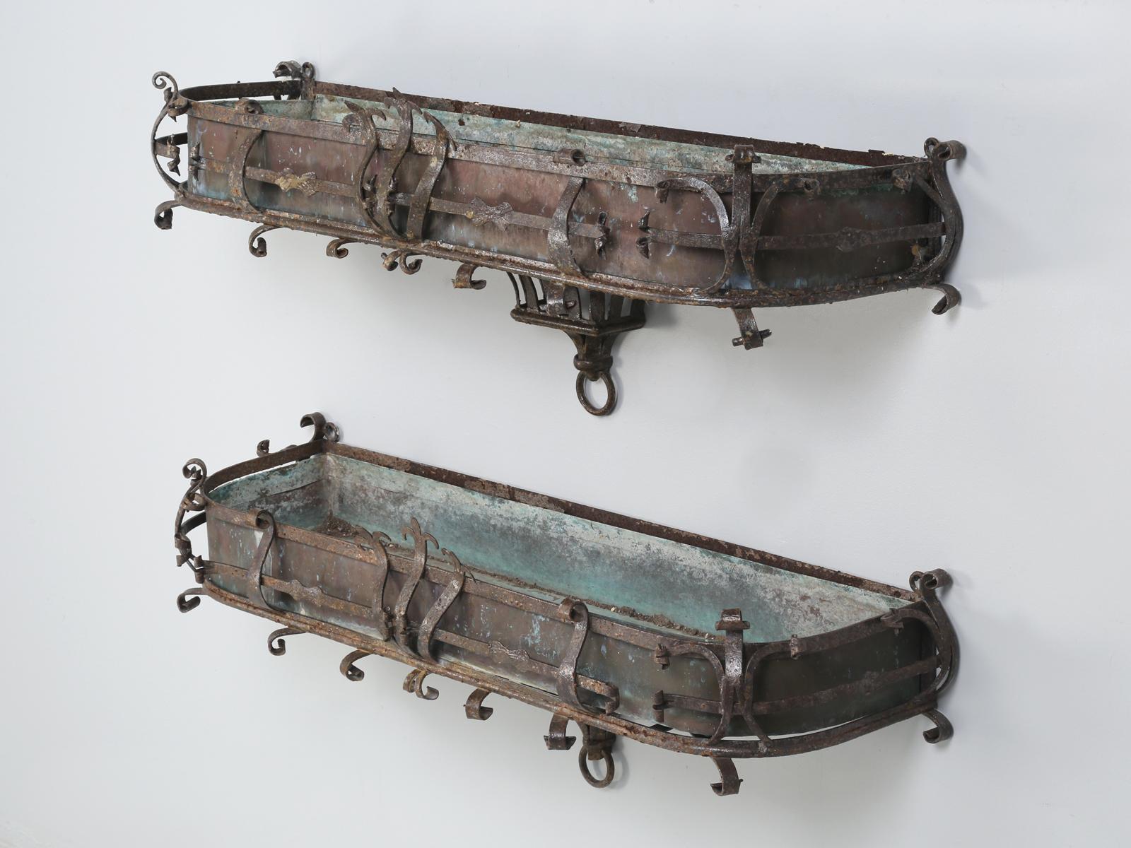 Pair of antique Italian window boxes made of copper and steel. Not only are antique window boxes rare, but to find a pair of antique Italian window boxes, this great looking is almost unheard of. We carefully clear-coated the old finish with an
