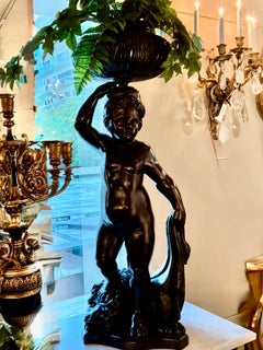 Ein Paar antiker italienischer, geschwärzter, geschnitzter Holzfiguren/Jardinières