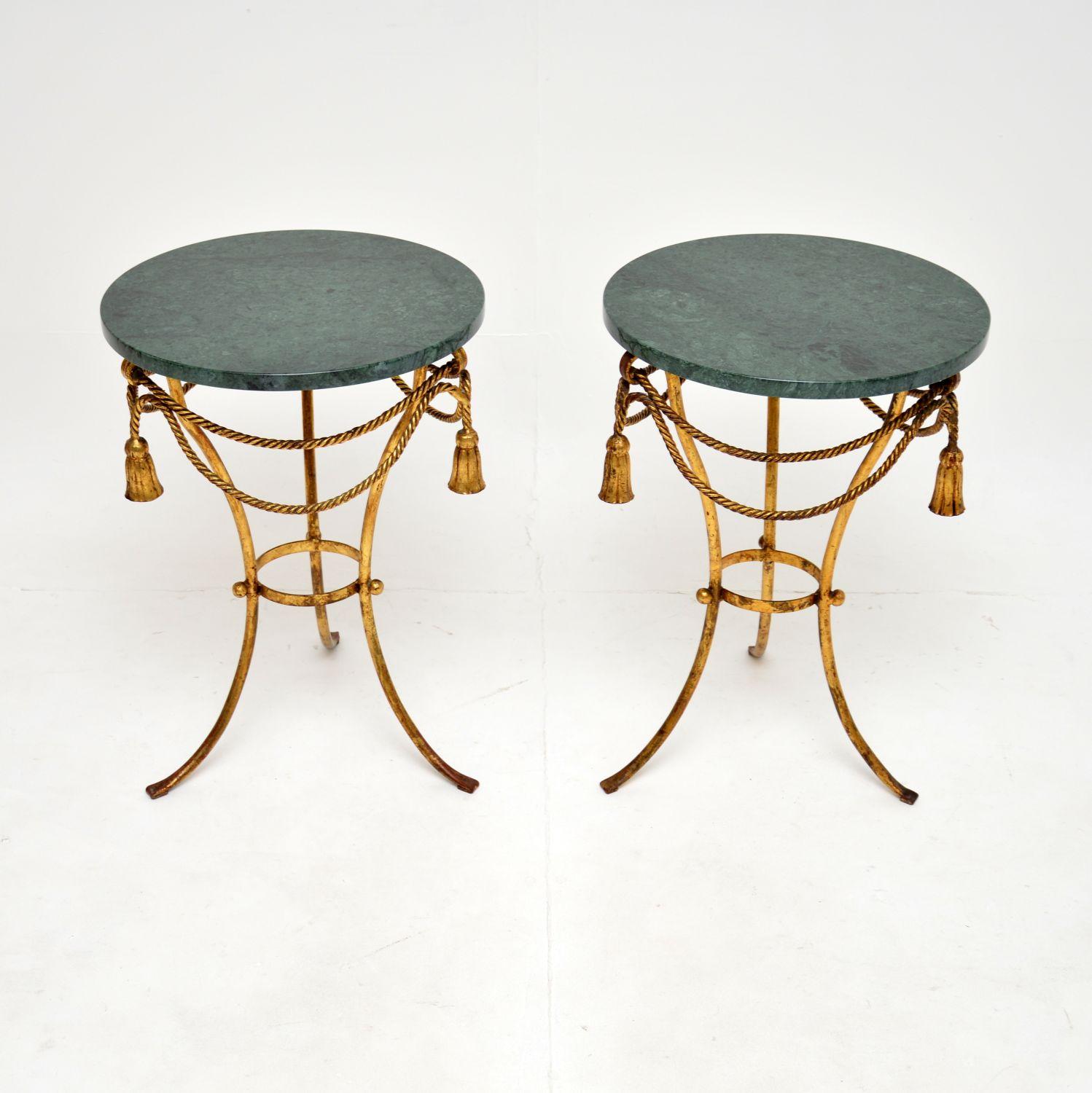 A superb pair of antique Italian gilt metal and marble side tables. They were made in Italy in the Hollywood Regency style, they date from the 1950’s.

The quality is absolutely superb, the gilt metal frames have a gorgeous rope twist and tassel