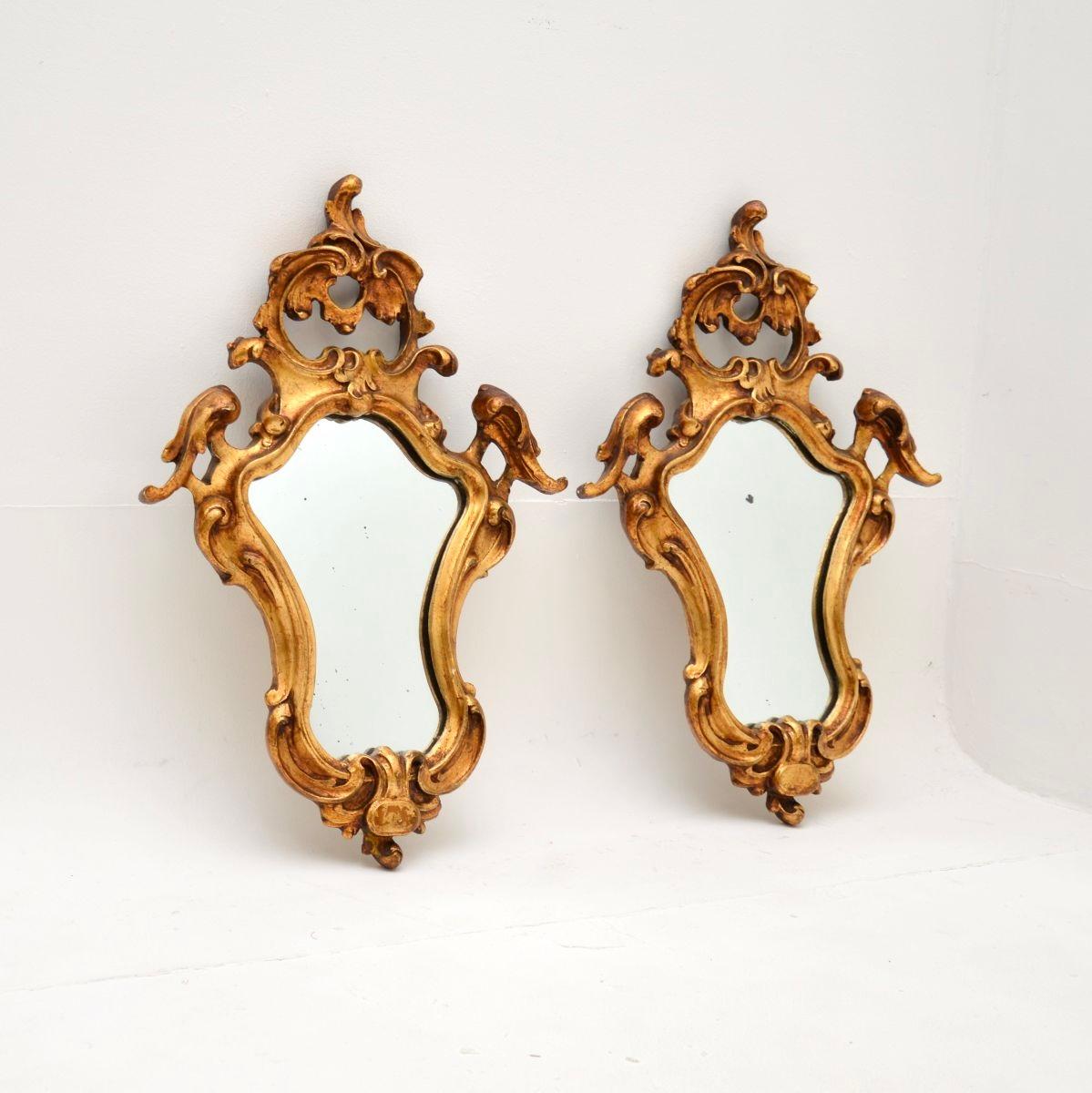 A gorgeous pair of antique Italian gilt wood mirrors, dating from around the 1950’s.

They are of superb quality and are a lovely size. They have a beautiful design and wonderful patina.

The condition is excellent for their age, there is just some