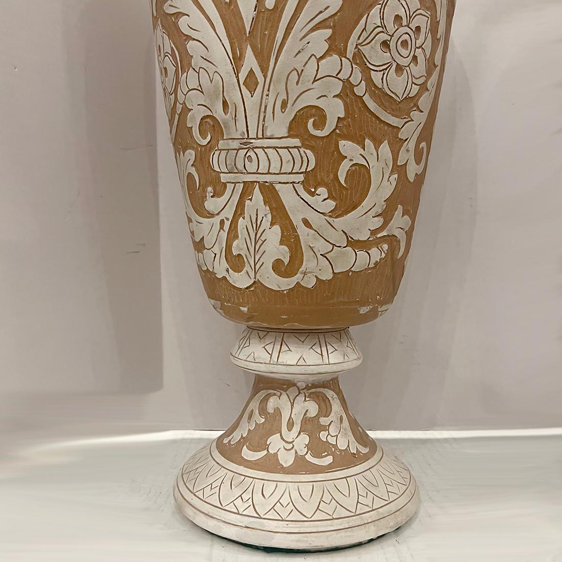 Pair of circa 1920's Italian ceramic lamps with foliage decoration.

Measurements:
Height of body: 19