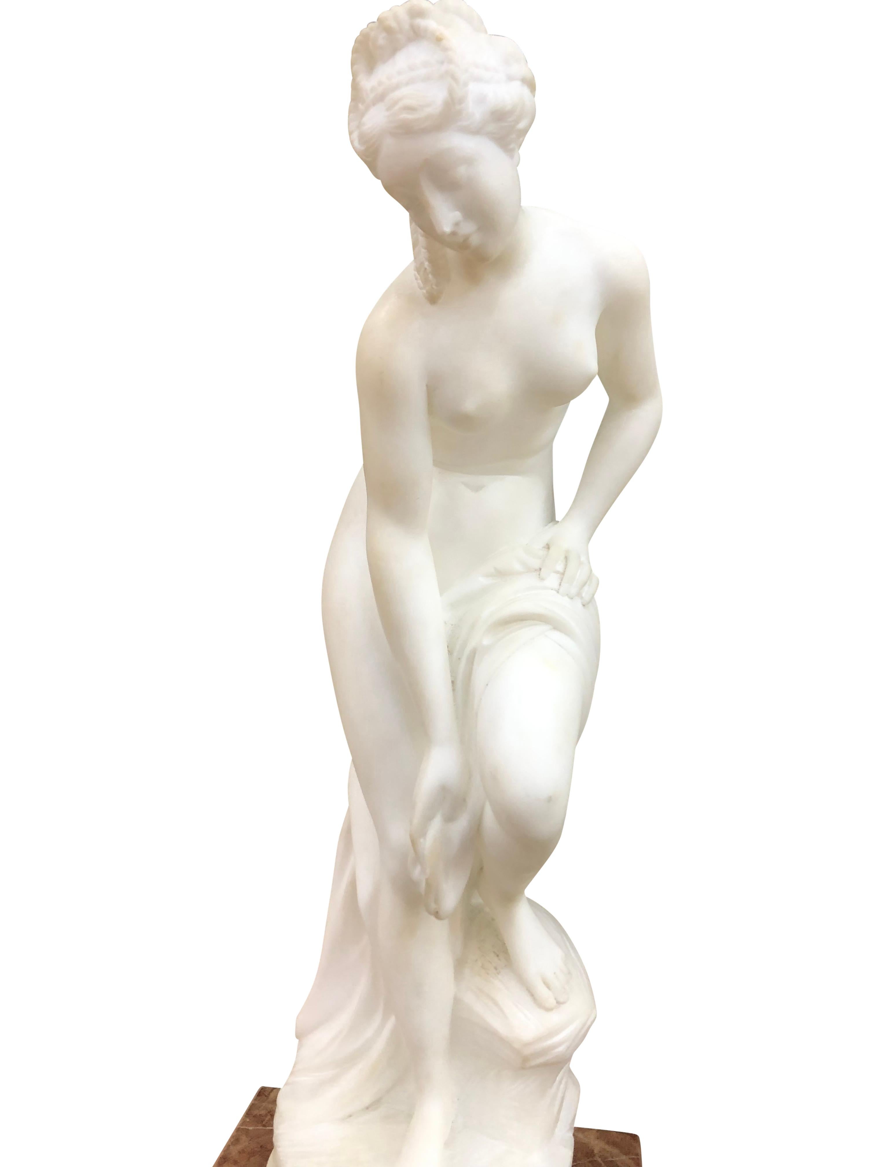Pair of Antique Italian Marble Sculpture of Classical Female Nude Figures. Crafted with exquisite precision, each piece depicts a captivating female nude figure, celebrating the idealized beauty of the human form. Meticulously carved from rich