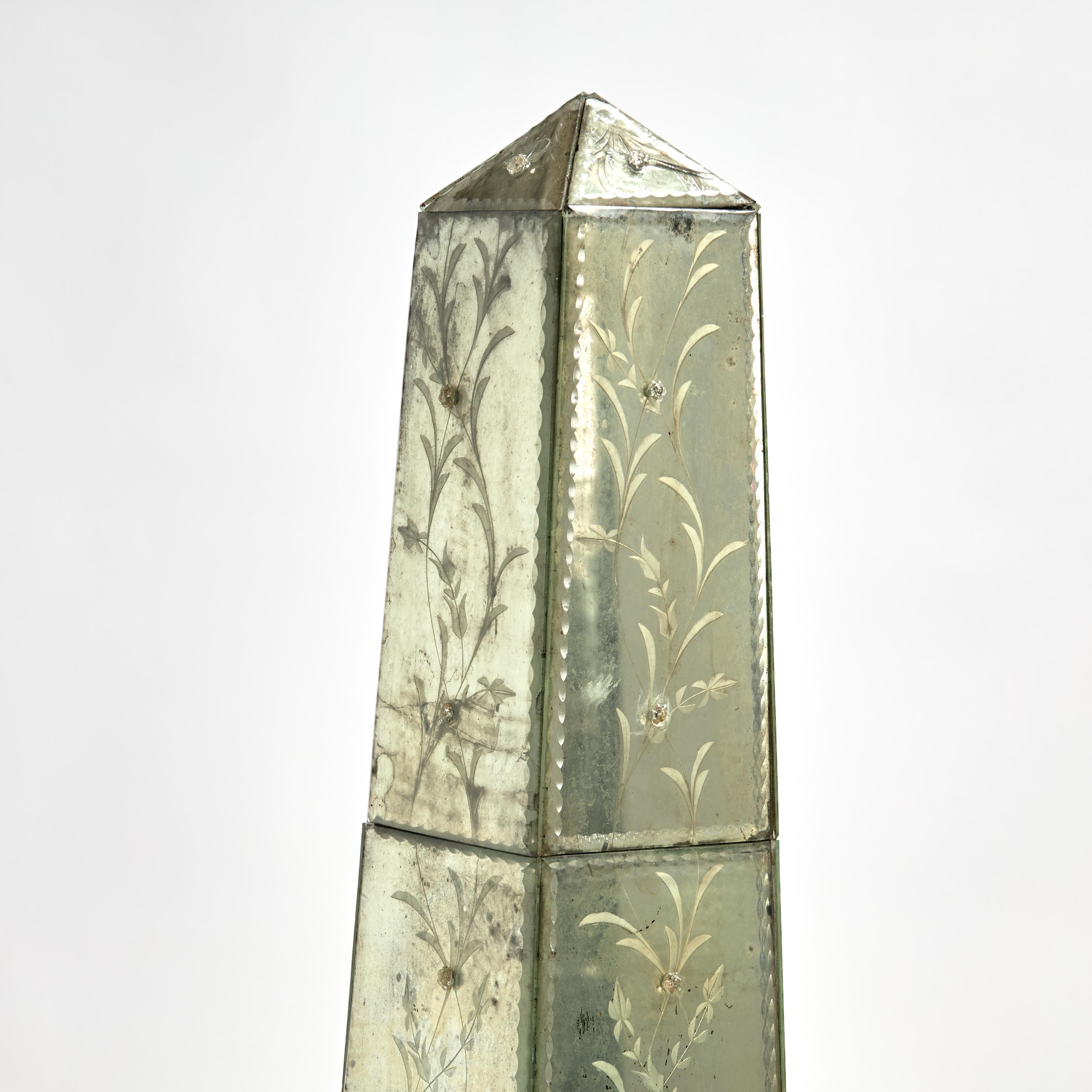 Standout pair of 19th Century neoclassical Italian obelisks clad in mirrored sections with etched floral designs now oxidized to perfection with the expected imperfections. Presented on silvered paw feet added sometime later. 
